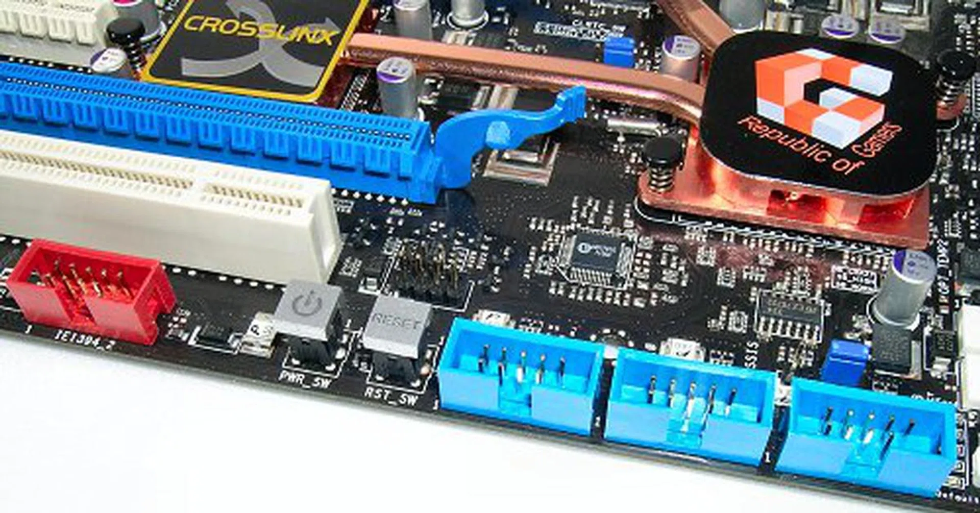 Extra USB and FireWire headers neatly line the bottom of the board. Seen here are the Reset and Powe switches as well.