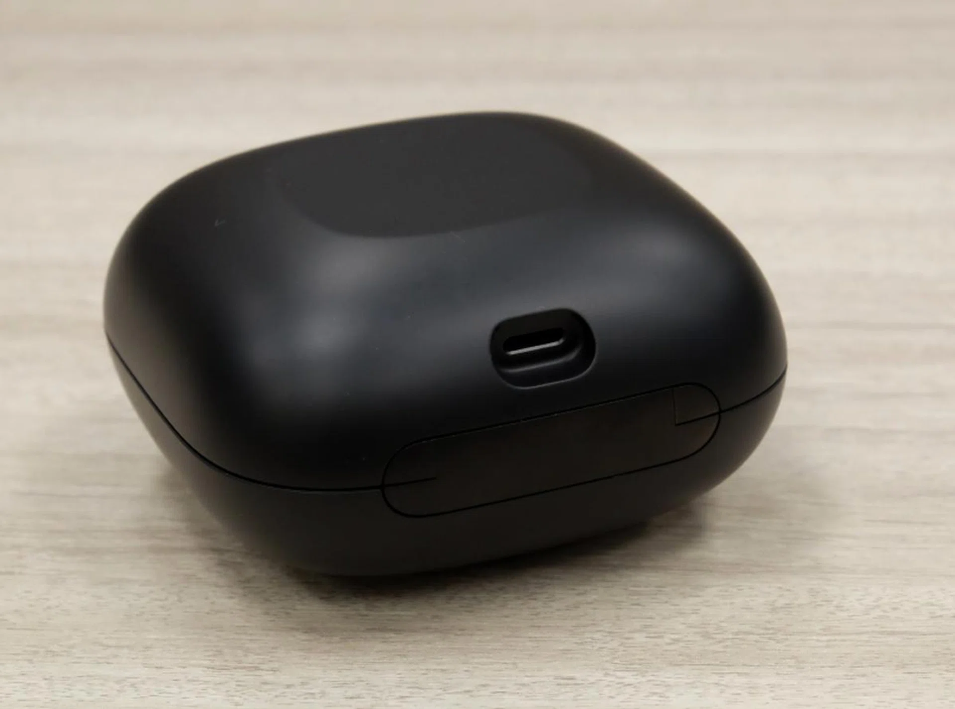 The charging case charges via a Lightning connector.