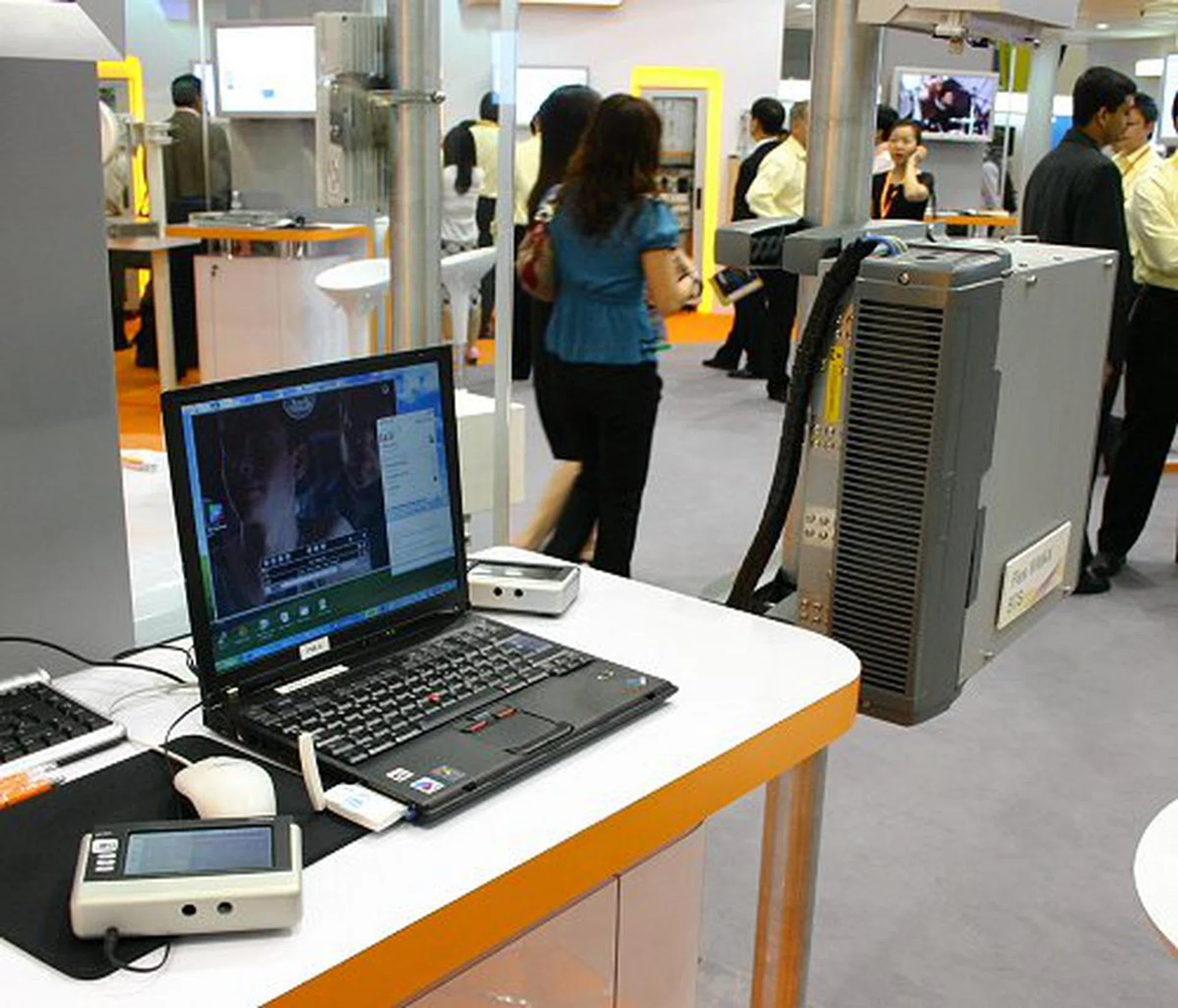  Soon to be a reality in most cities around the world, WiMAX was being demonstrated at the booth as well. Here, we have the WiMAX transmitting module (far right) providing high-speed wireless connection for the notebook and a Nokia N770 Internet Tablet (far left).  