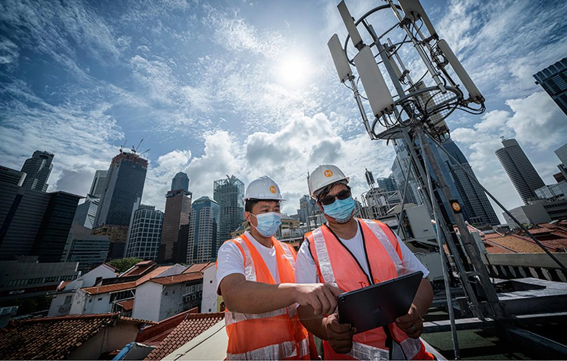 M1's engineers toiling behind the scenes to bring up its 5G networks. Image credit: M1.