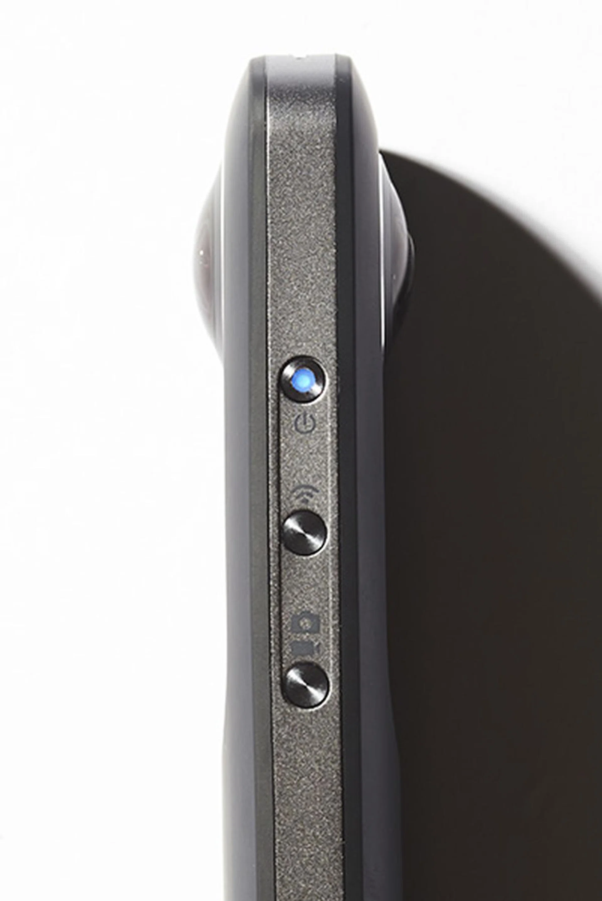 Three small buttons on the side allow for switching between modes and initiating the Wi-Fi connection,