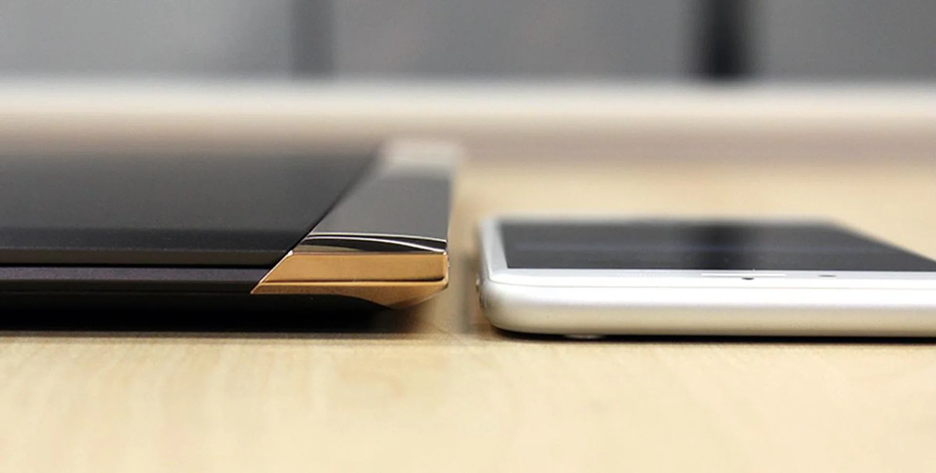 How thin is the Spectre? Here it is next to an iPhone 6s.