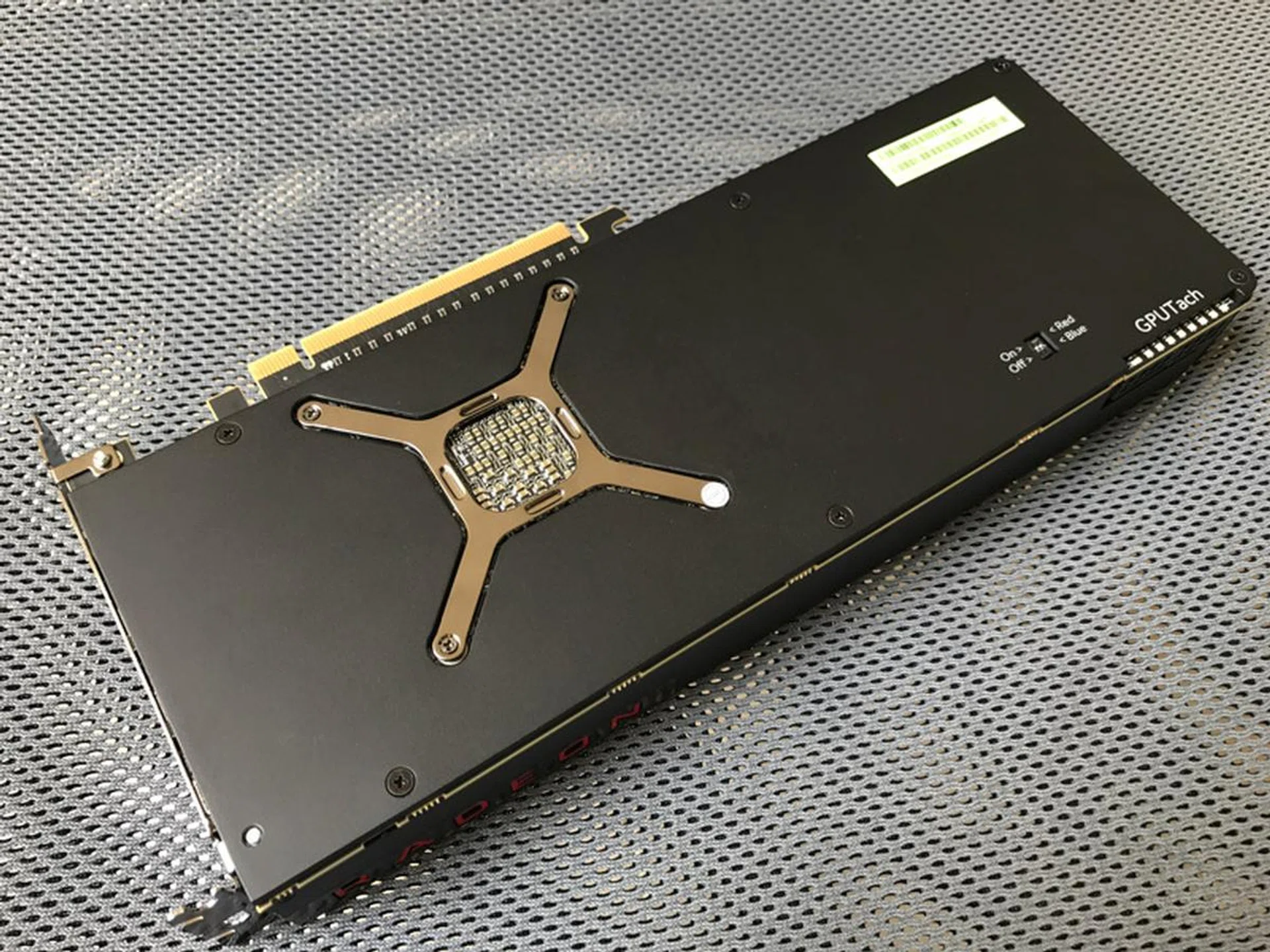 Unlike its slower Radeon RX 480 sibling, the Radeon RX Vega 64 is covered from front, all the way to its back.