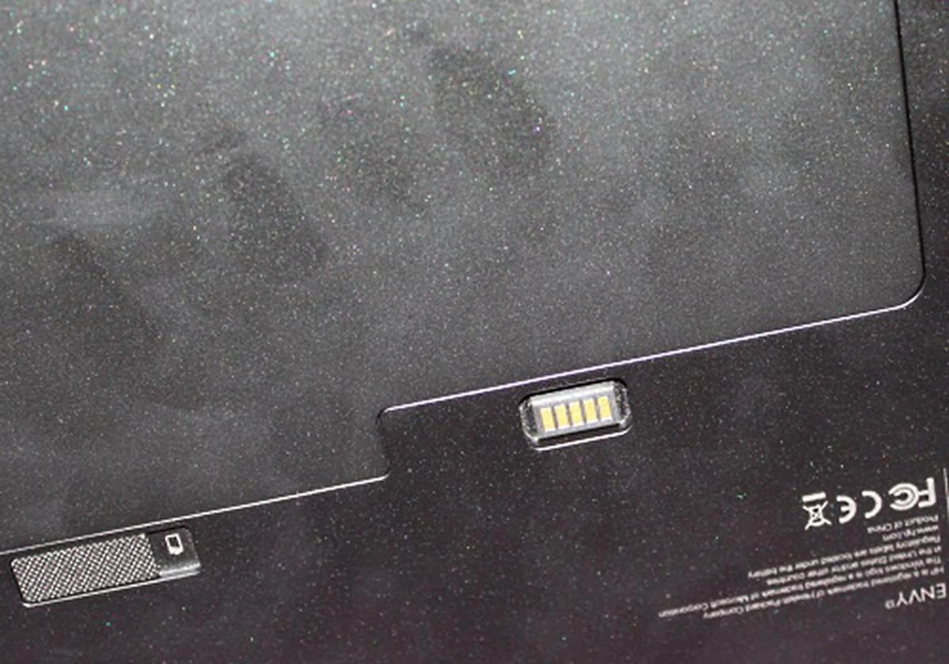 Underneath, we found the slim and relatively flat removable battery. You can also attach an extended battery to the bottom.