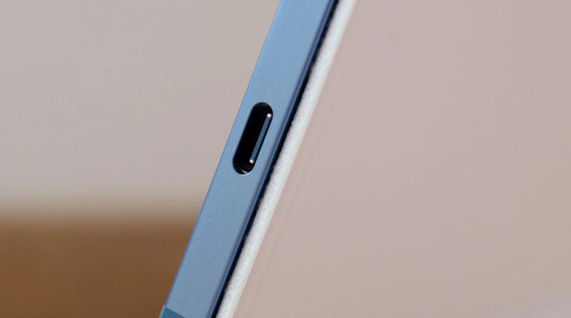 The USB-C port doesn't support Thunderbolt like the "Pro" iPads but it does have higher bandwidth.