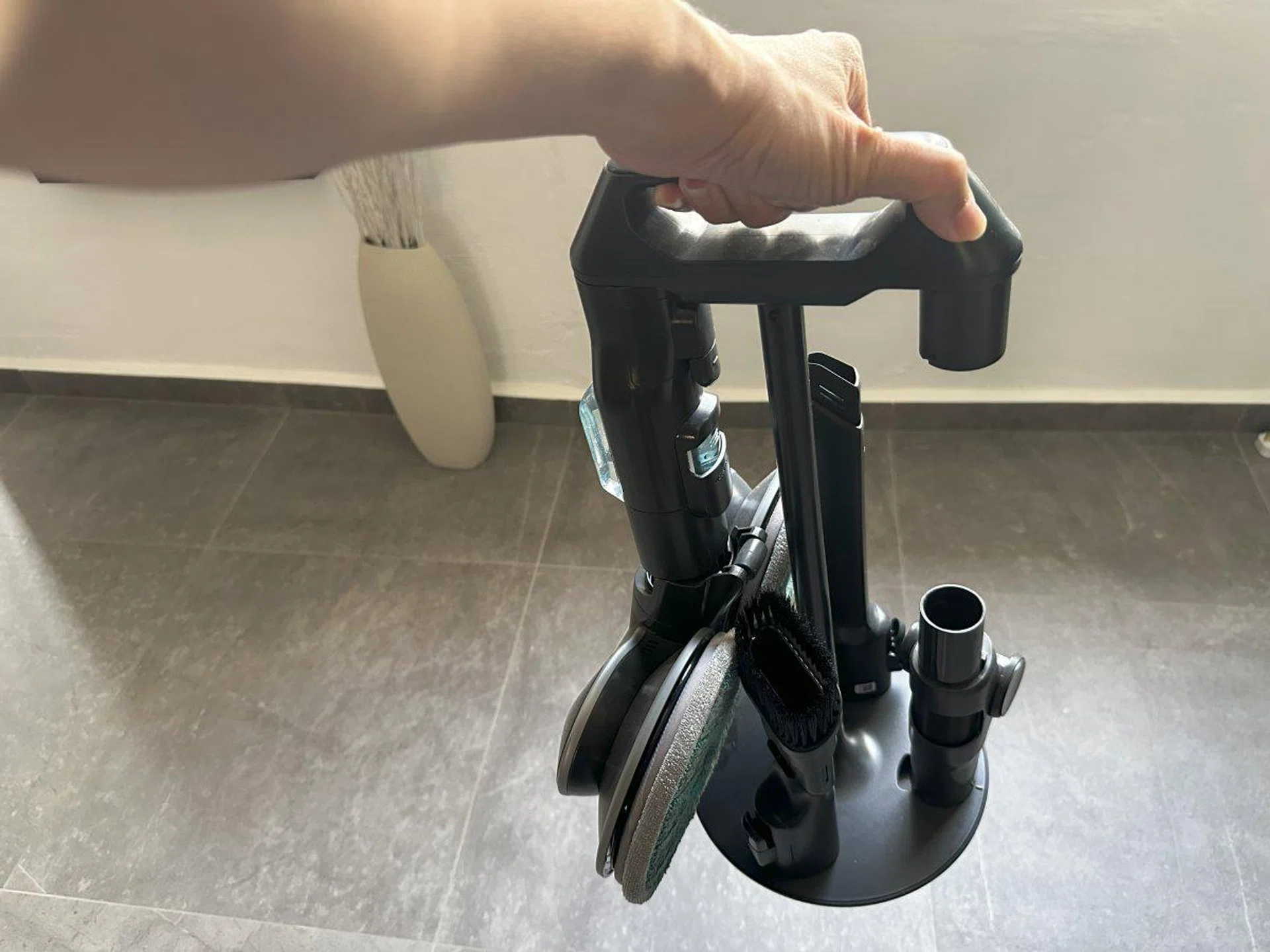 The attachment cradle is handy to bring around while cleaning, but it's an eyesore next to the All-in-One Station.