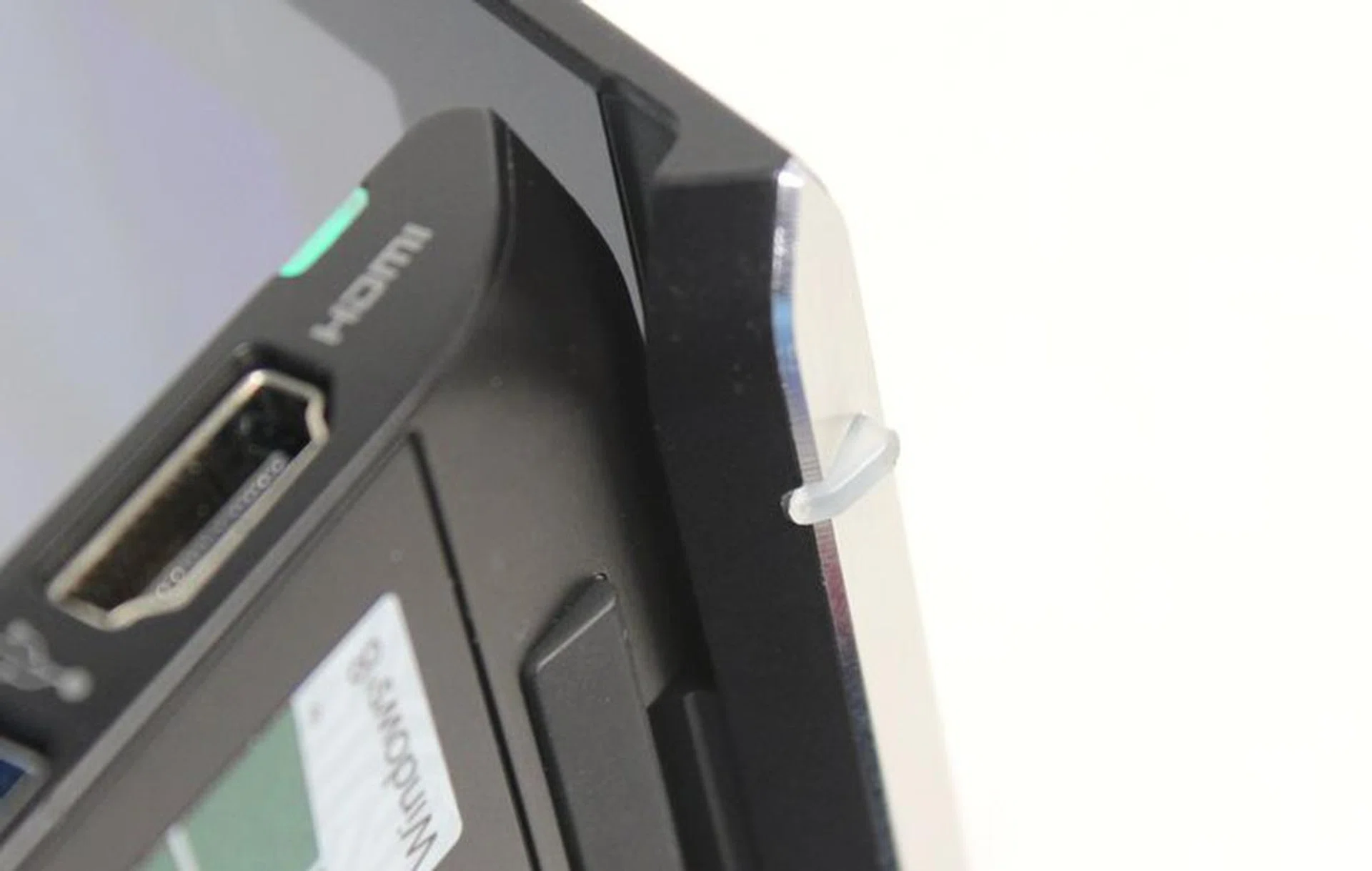 There's a rubber stopper behind the lid of the display, which prevents your notebook from being scratched and provides extra traction so your notebook doesn't move about on smooth surfaces. 