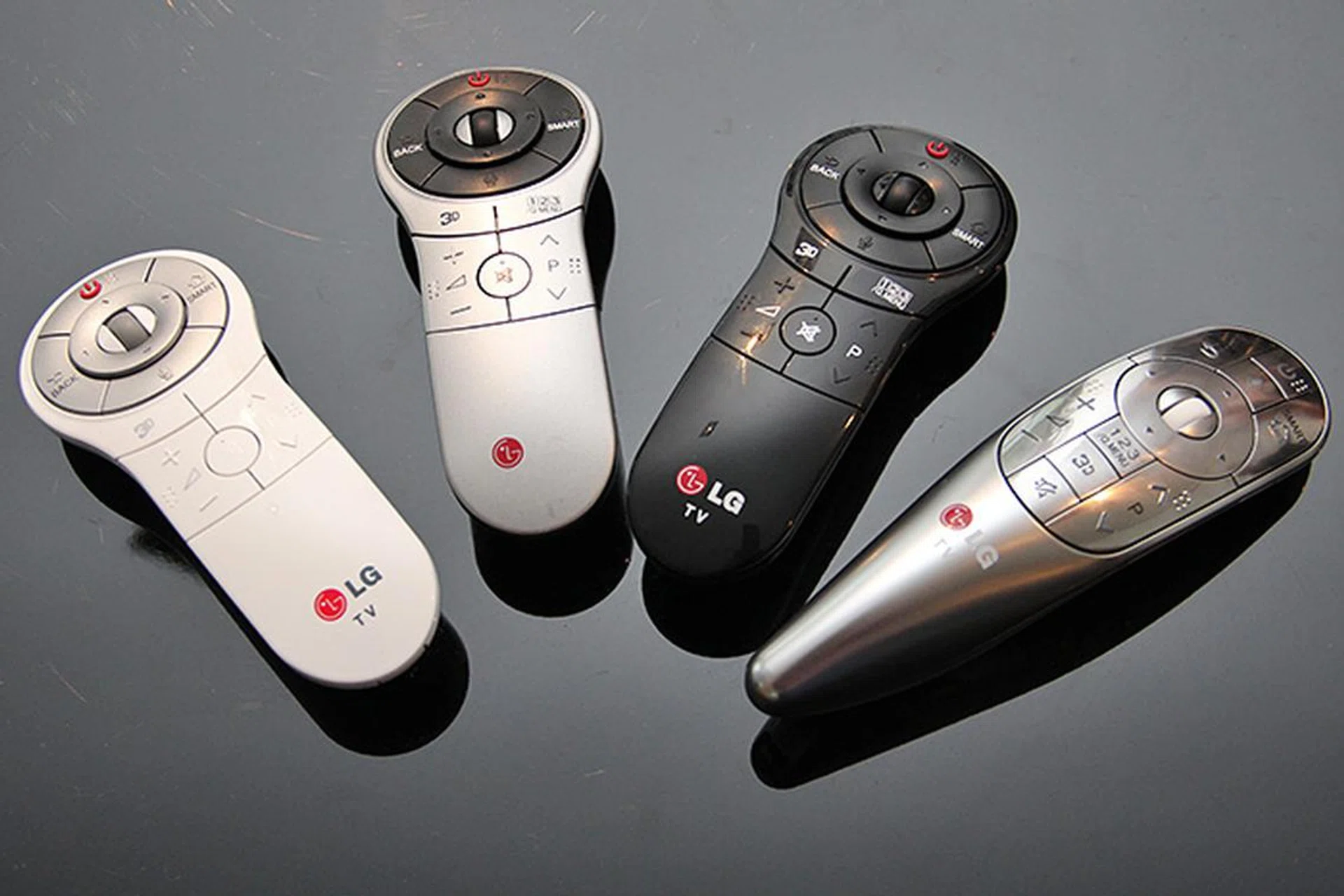 The Wii Remote-like Magic Remote from LG. The longish metallic gray Magic Remote (fourth remote in the picture) is only for the LA8600 series. The standard Magic Remote comes in different colors (white, gray, or black depending on the TV's cabinet/stand color) are for the other series.