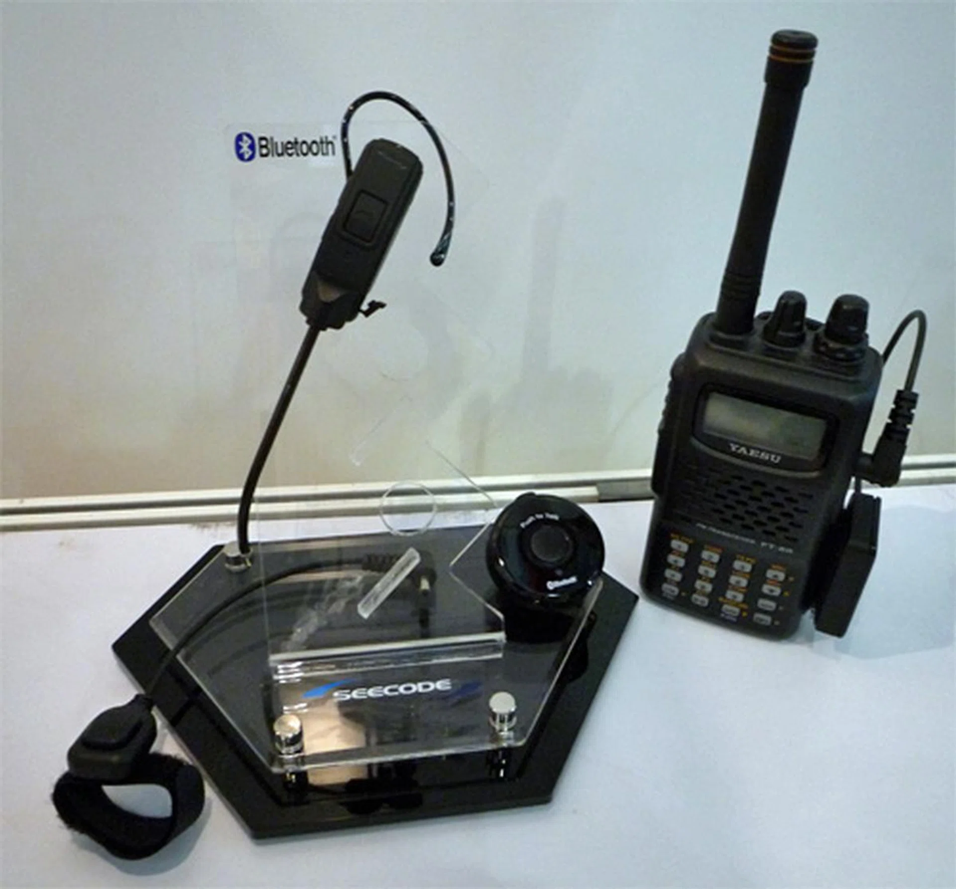  Seecode touts its Bluetooth devices as the world's first Bluetooth Headset for Push to Talk devices, such as walkie-talkies. Pictured is Bluetooth PTT Special.  