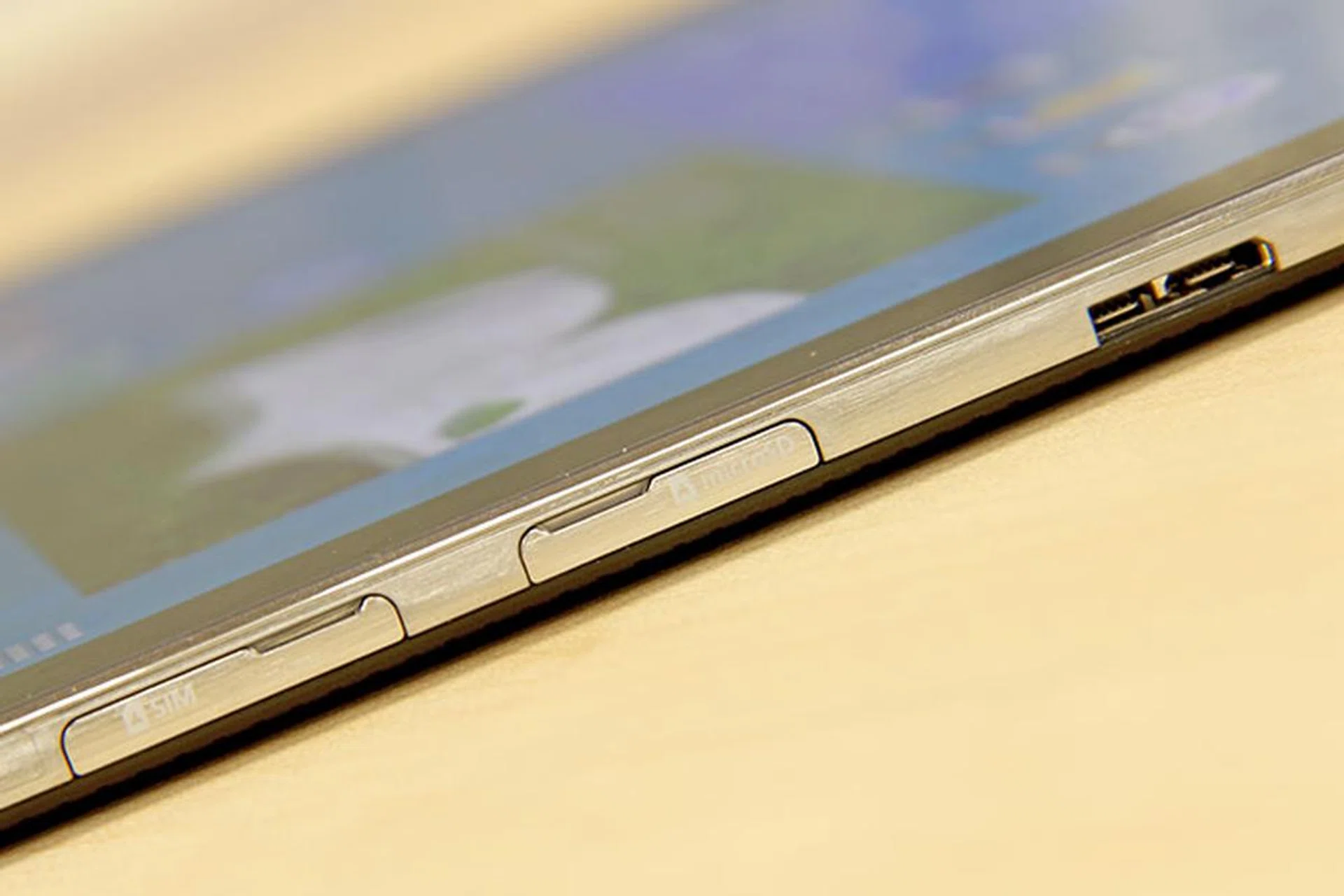 The micro-USB 3.0 port (backward compatible with micro-USB 2.0) is now on the right side, above the micro-SIM and microSD card slots.