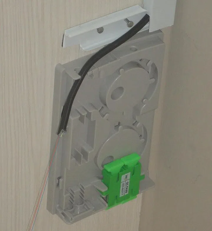 Here's the fibre termination box installed without its cover and before the cable terminating at the green connector. Note the trunking used for installation has barely space more than the fibre cable itself, so it's certainly a smaller conduit than those you would have normally seen. I'll get that painted soon to blend in better.