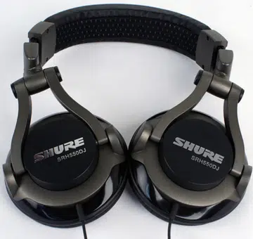 The Shure SRH550DJ Headphones with the ear cups rotated to their maximum 45-degree angle, lying flat against the table in our labs.