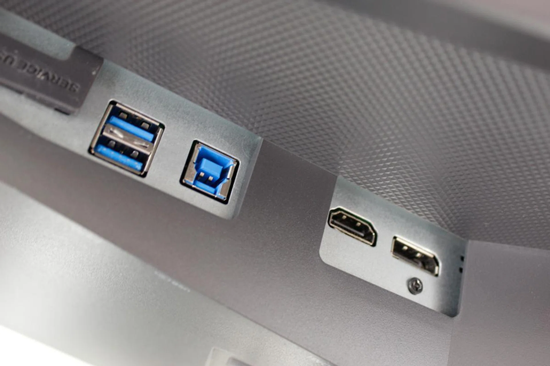 The monitor only has two USB 3.0 ports and they're stashed away behind the display in a hard to access area.