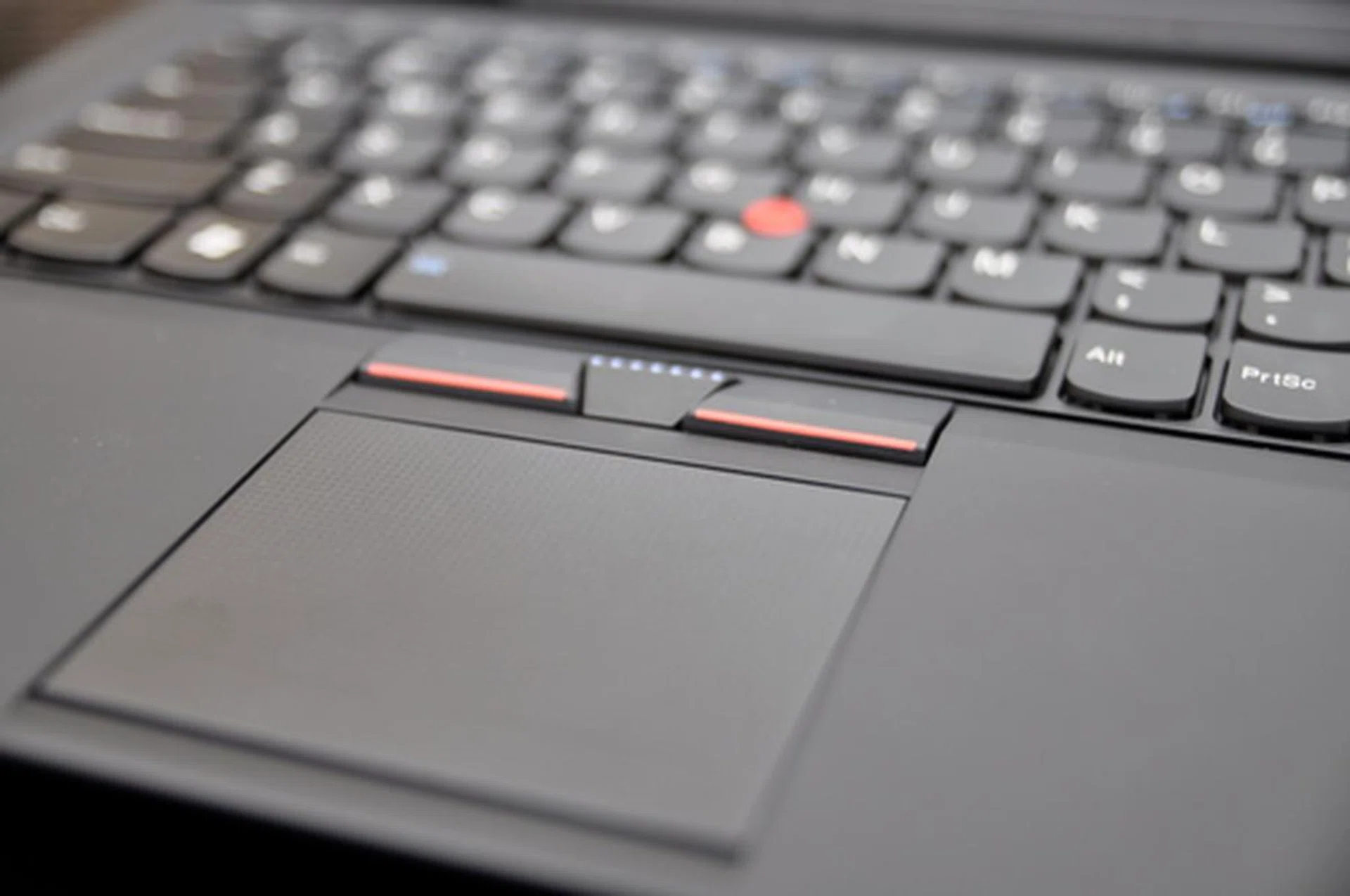 Due to the lack of space, a smaller but button-less trackpad is used to make room for tracking.