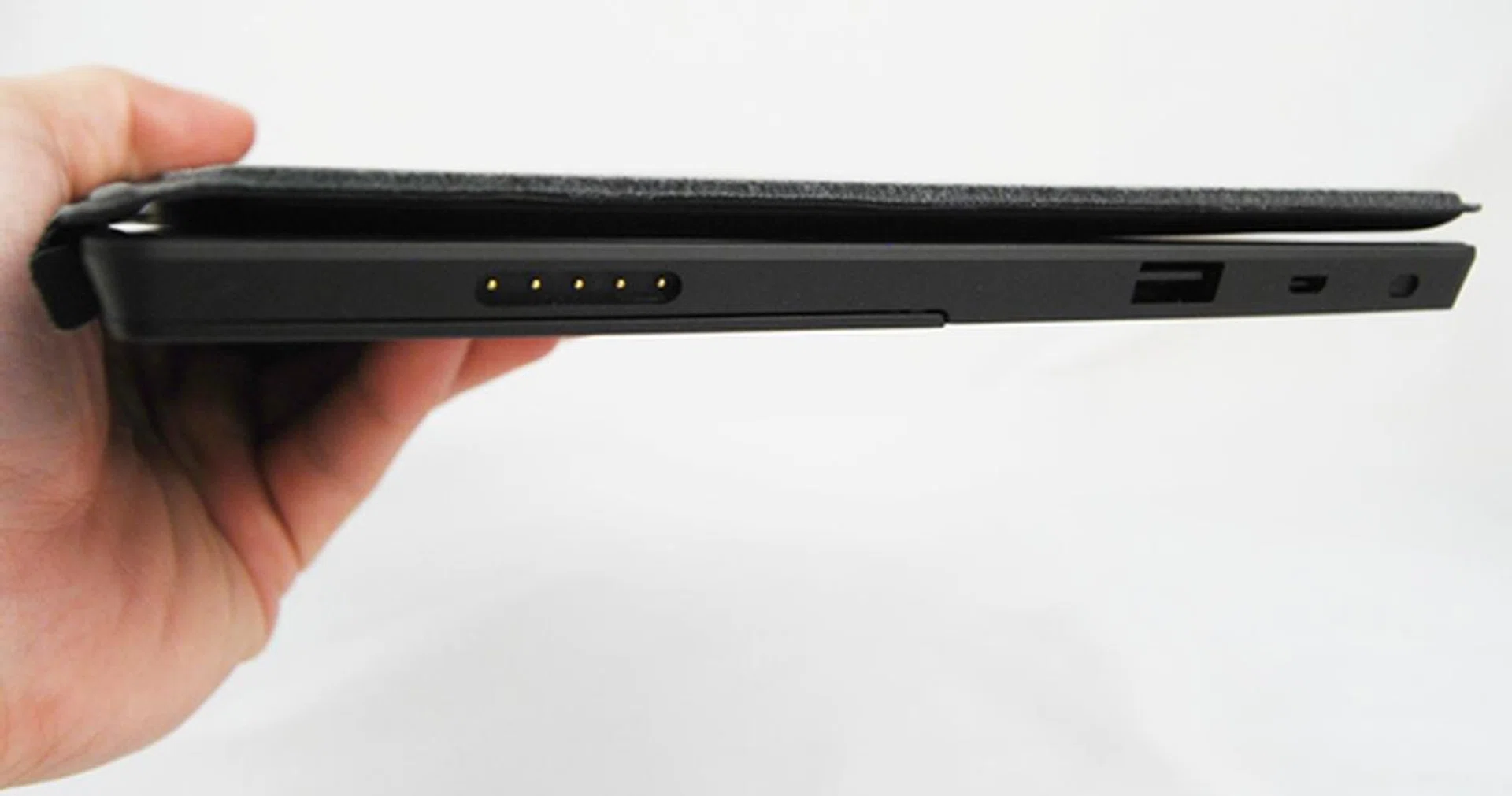 From our prior experience reviewing the other tablets' keyboard accessories, we prefer Microsoft's implementation as it hardly adds bulk to the tablet, and docking the Type Cover is much easier on-the-go. Usability it pretty good as well.
