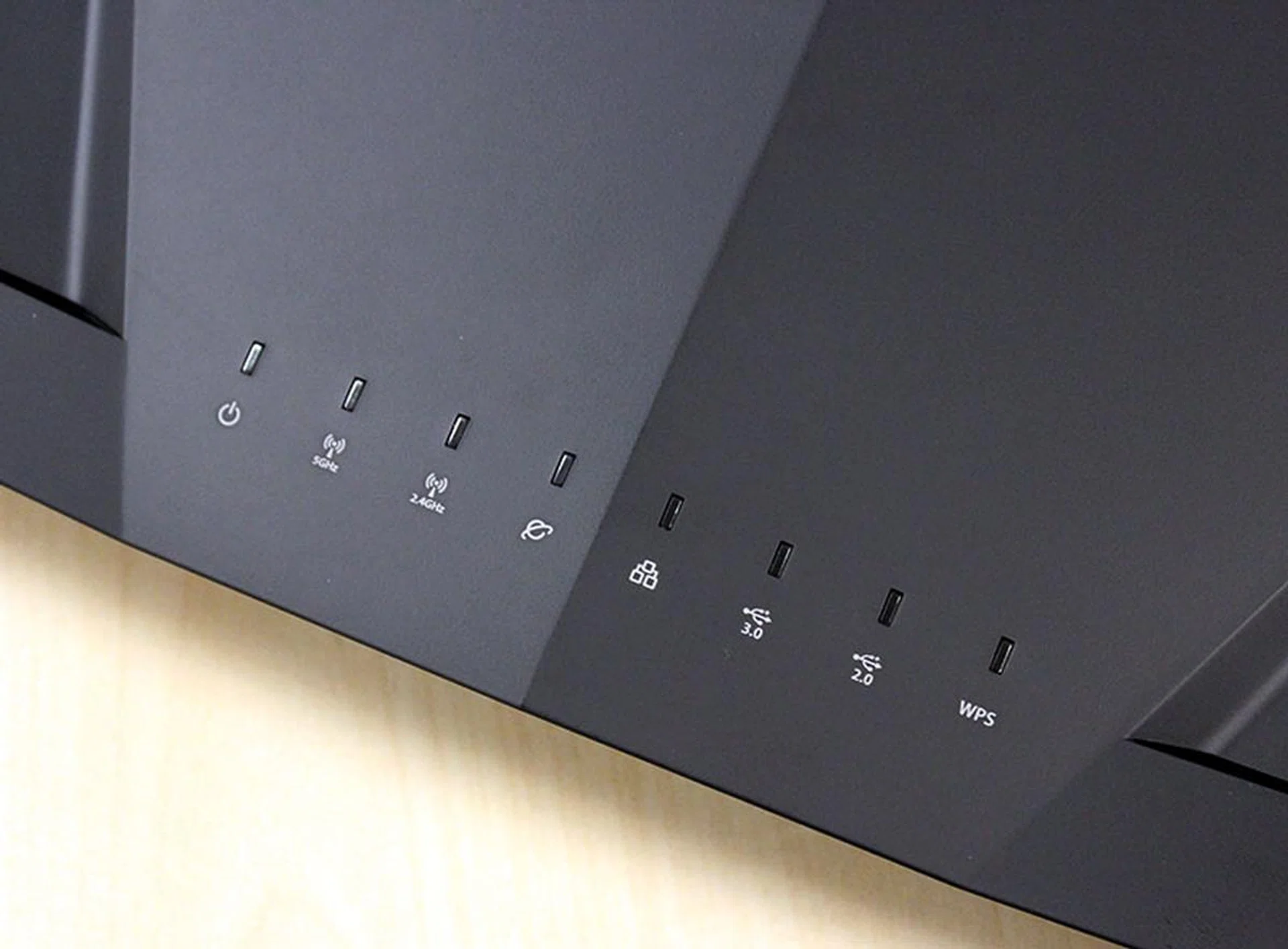 A handy row of LED status indicators sit on the top panel of the RT-AC88U router.