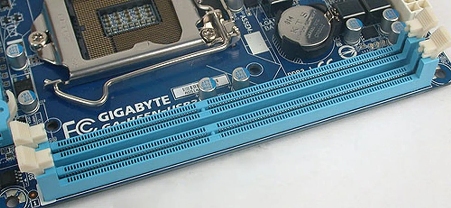 Two DIMM slots supporting a dual-channel architecture of up to DDR3-1666 (O.C). The retention clips are close enough to the single PCIe 2.0 x16 slot that we can see some issues here during installation/removal of memory modules. 