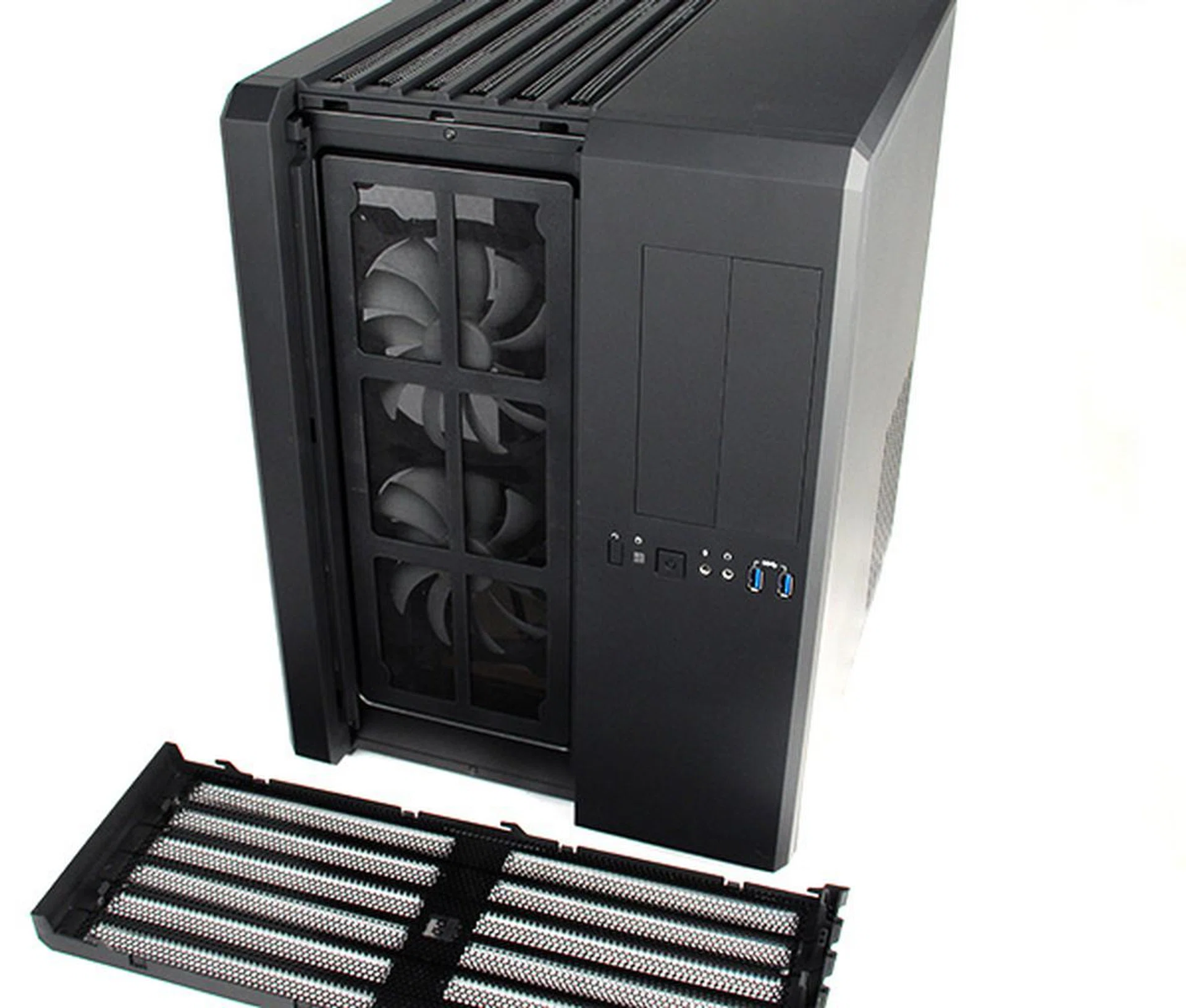 Removing the front grille reveals the removable dust filter and the two large intake fans.