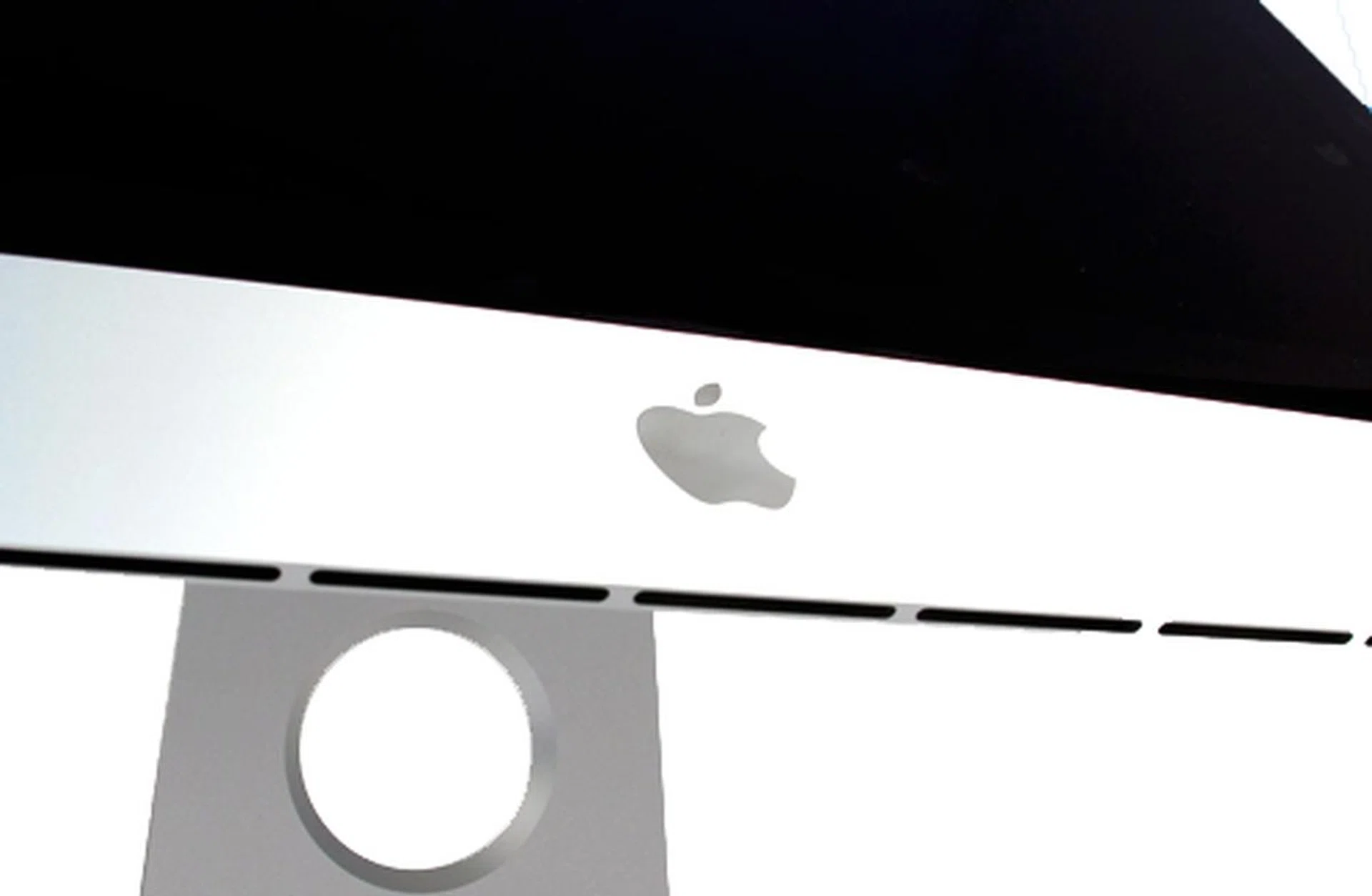The speakers are downward firing and are hidden at the bottom of the display.