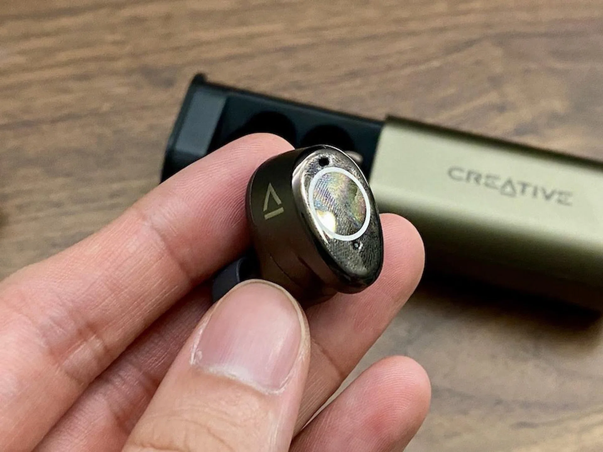 The Outlier Pro earbuds are slightly larger. Their glossy finish also means they smudge easily.