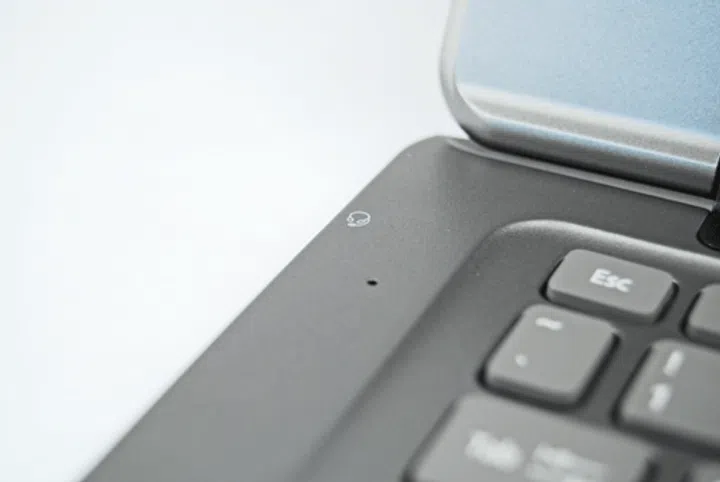 The left of the machine is where you will find the microphone, as well as a headphone jack on the side.