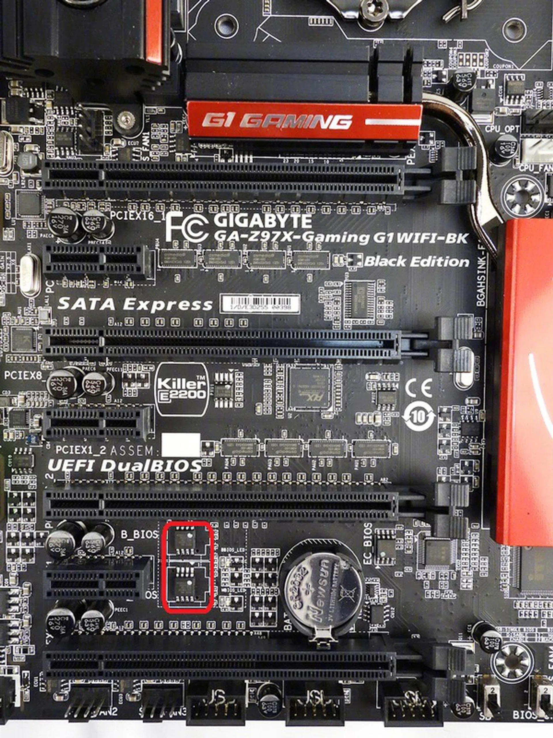 In addition to the four PCIe x16 slots, there are three PCIe 2.0 x1 expansion slots. Near the last PCIe 2.0 x1 slot, is a pair of BIOS chips that support the board's DualBIOS feature.