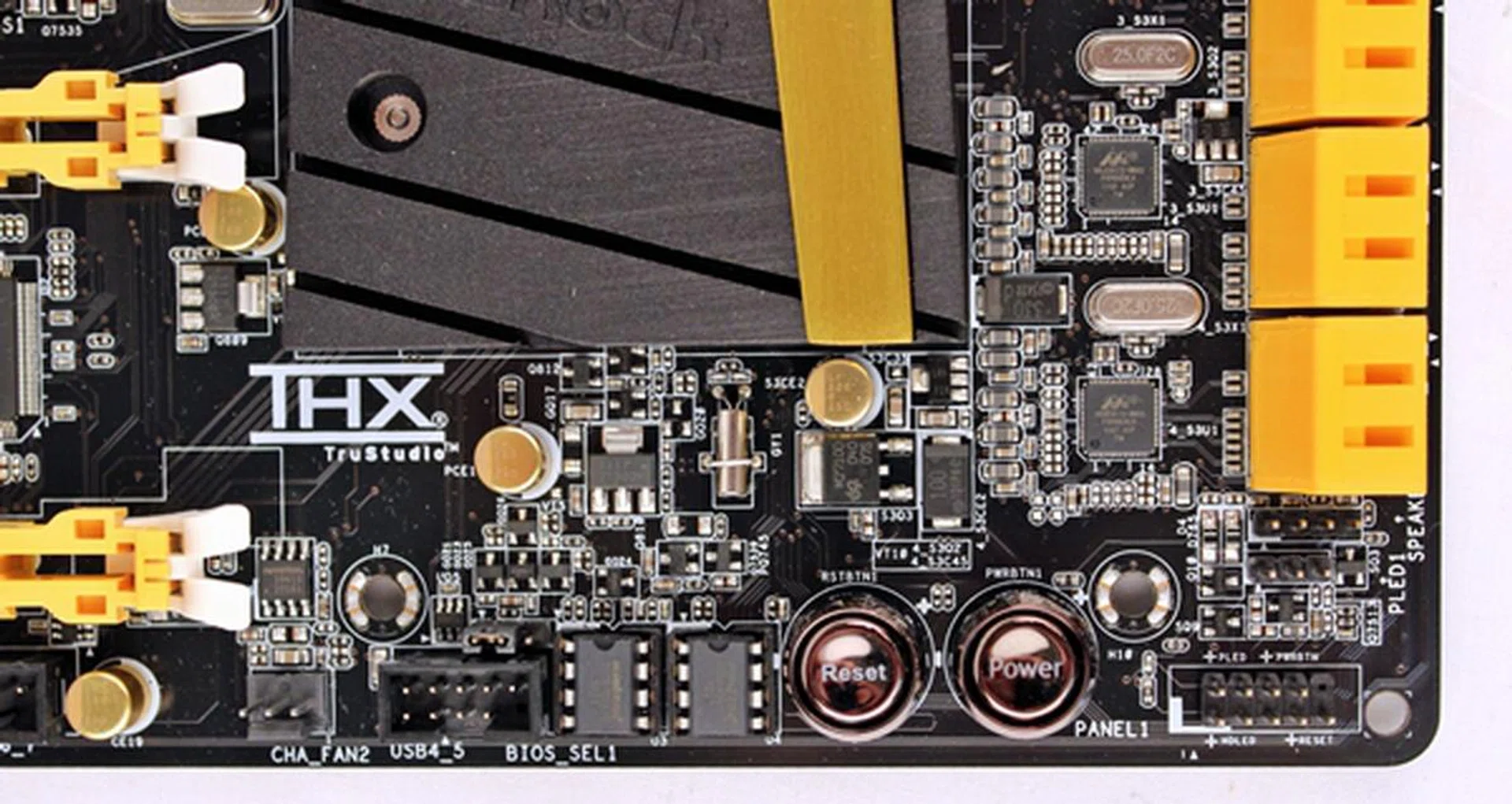 There are a pair of Winbond BIOS chips; one stores the main BIOS while the other acts as a backup. They are located just next to the board's reset button. 