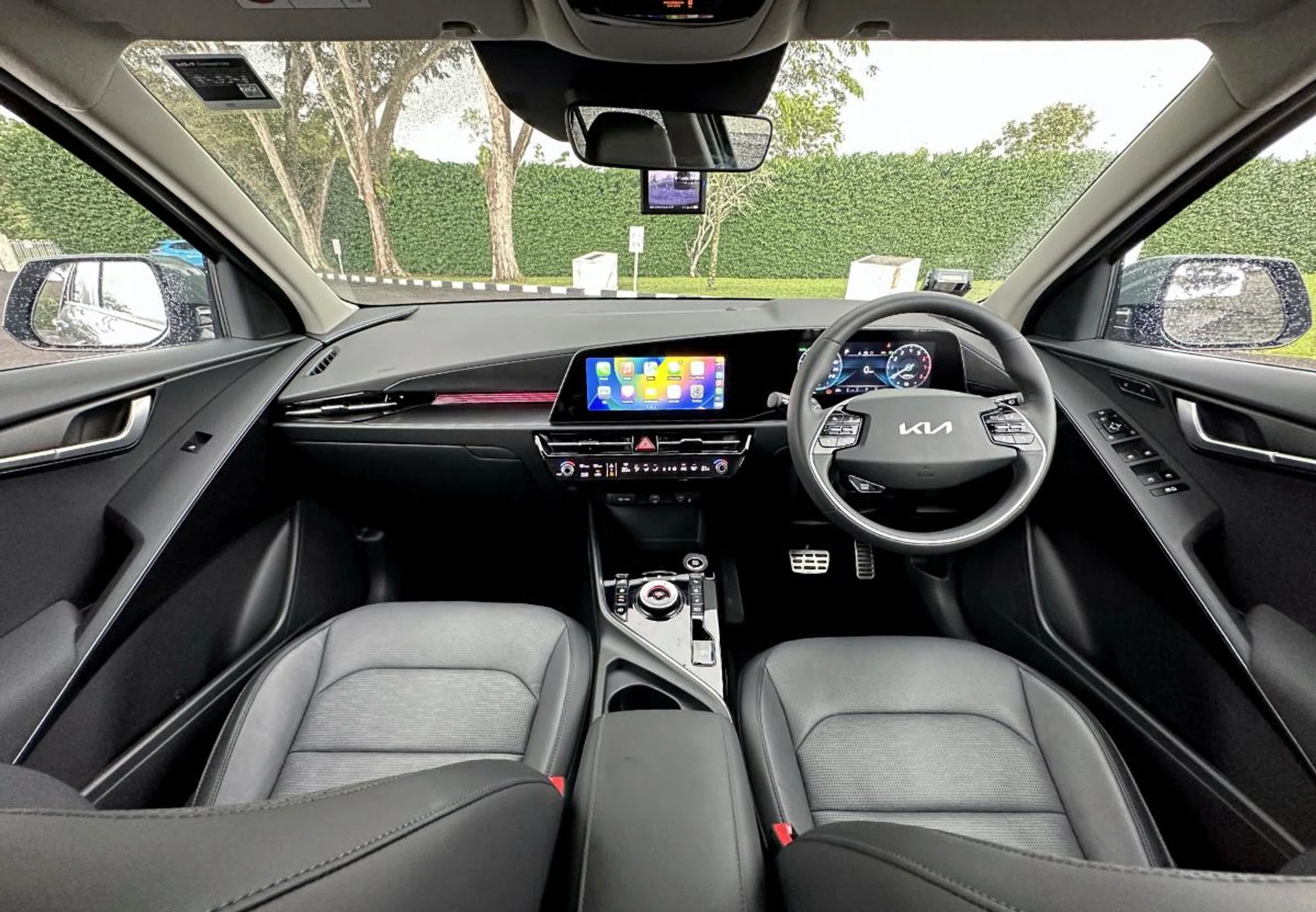 The cabin is spacious and airy. And as you can see, there's a lot of black plastic around the twin digital displays.