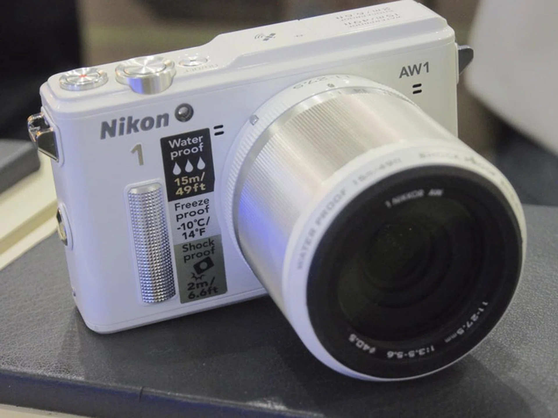 The Nikon 1 AW 1 is a 14.2-megapixel all-weather camera that's going for $999 with the 11-22.5mm f/3.5-5.6 lens. The body comes  in a choice of black, white, grey or orange. Purchase it at the show and get a free spare battery, one free 32 GB SanDisk connect wireless media drive, a 16GB SD card and a 32 GB SD card, and a tripod, neck strap, camera bag, dry cabinet , hand strap, and a wrapping cloth. 