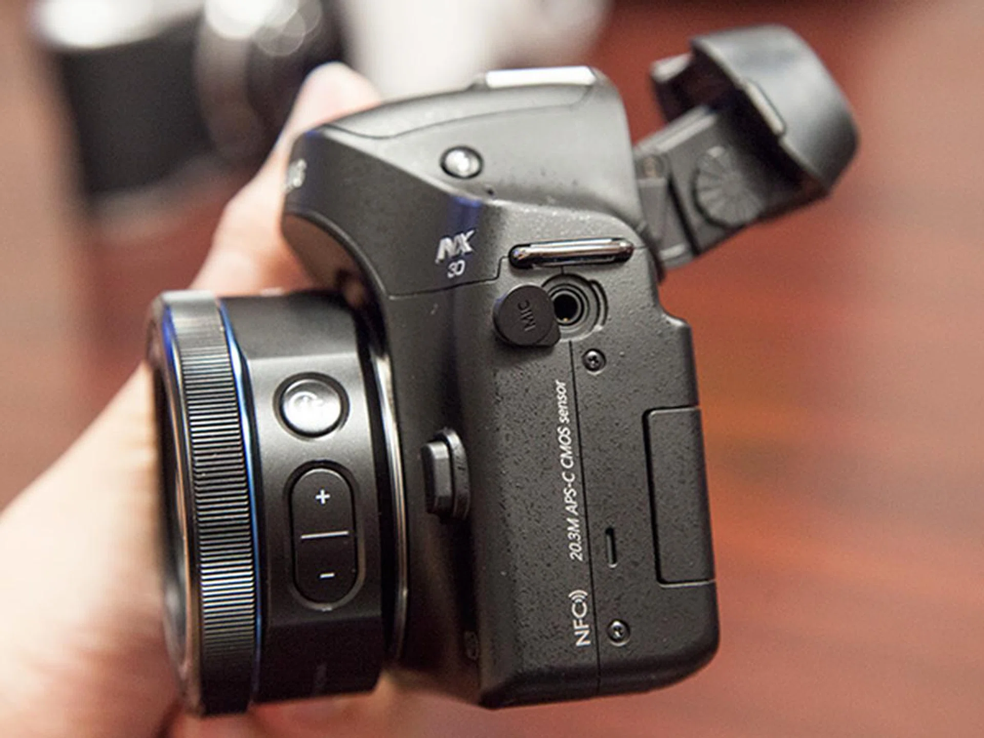 A microphone input jack is located on the left side of the NX30.