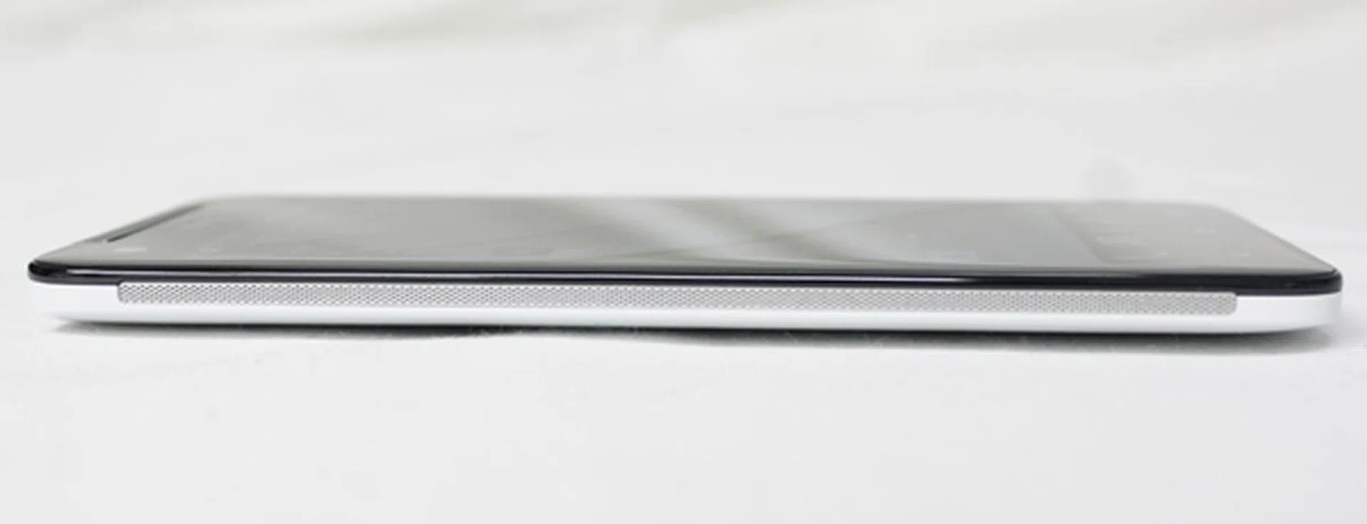 The perforated metal strips along the sides of the HTC Butterfly serve no functional purpose other than to give the phone a more premium feel.
