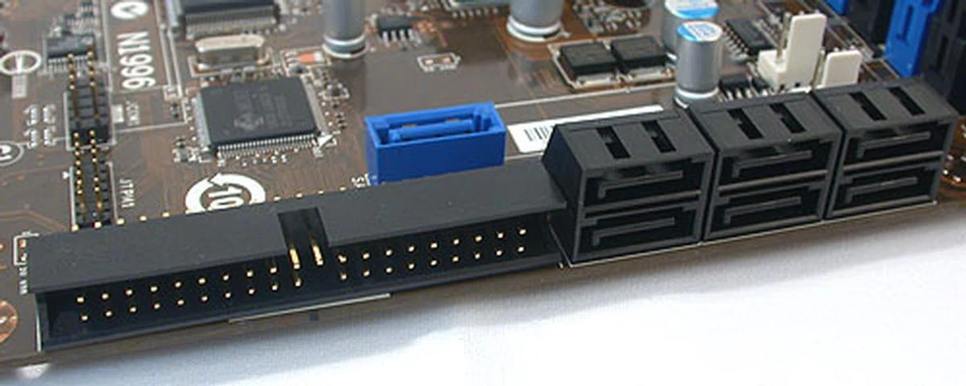Thanks to the ICH10R chip onboard, there are six SATA 3.0Gbps ports here, aligned at right angles to the board. The seventh (blue) SATA port and the rear eSATA port are from the JMicron JMB363 controller. So too is the support for IDE/PATA devices.