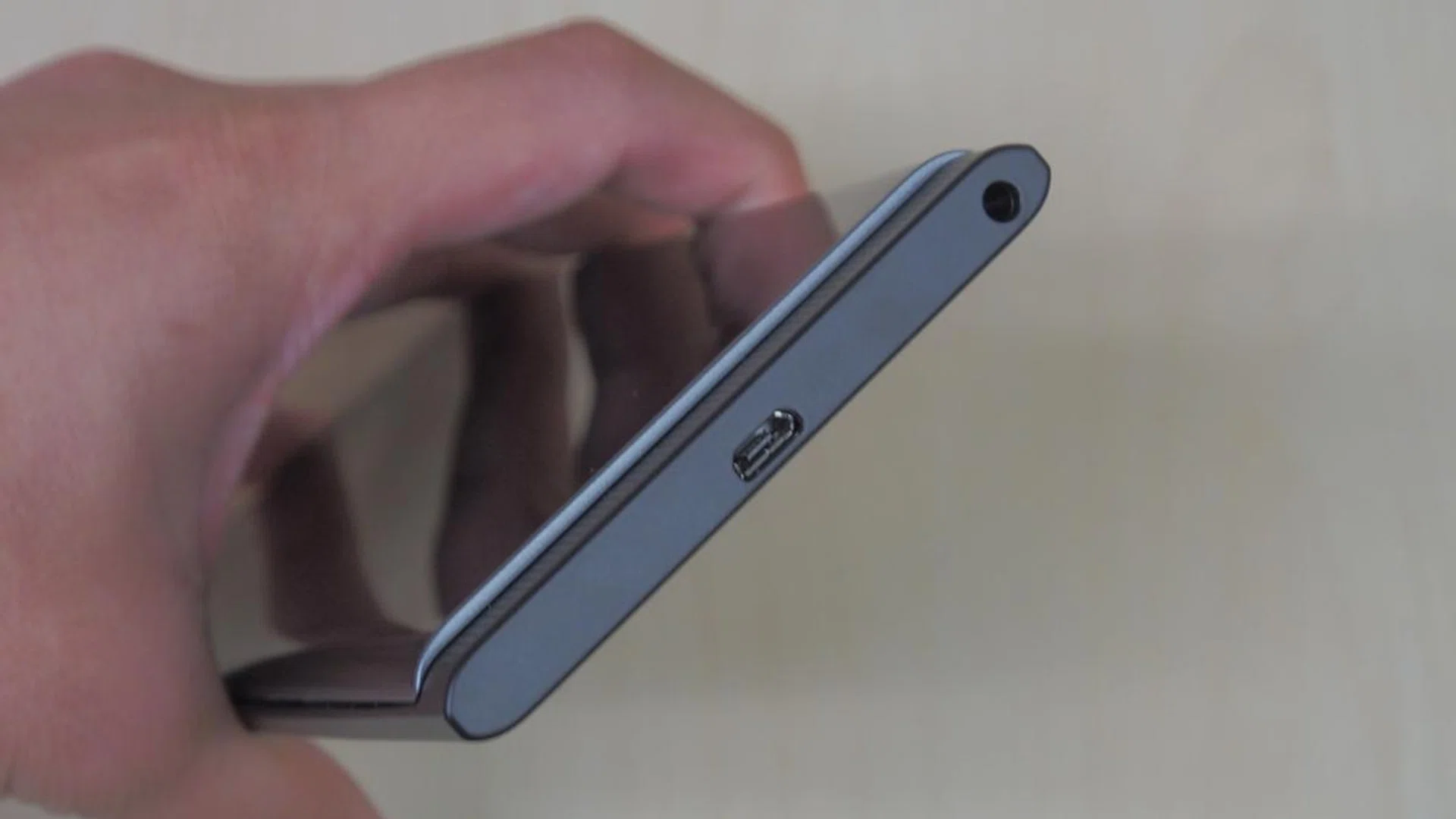 At the bottom of the phone, you'll find a micro-USB port and the 3.5mm audio jack.