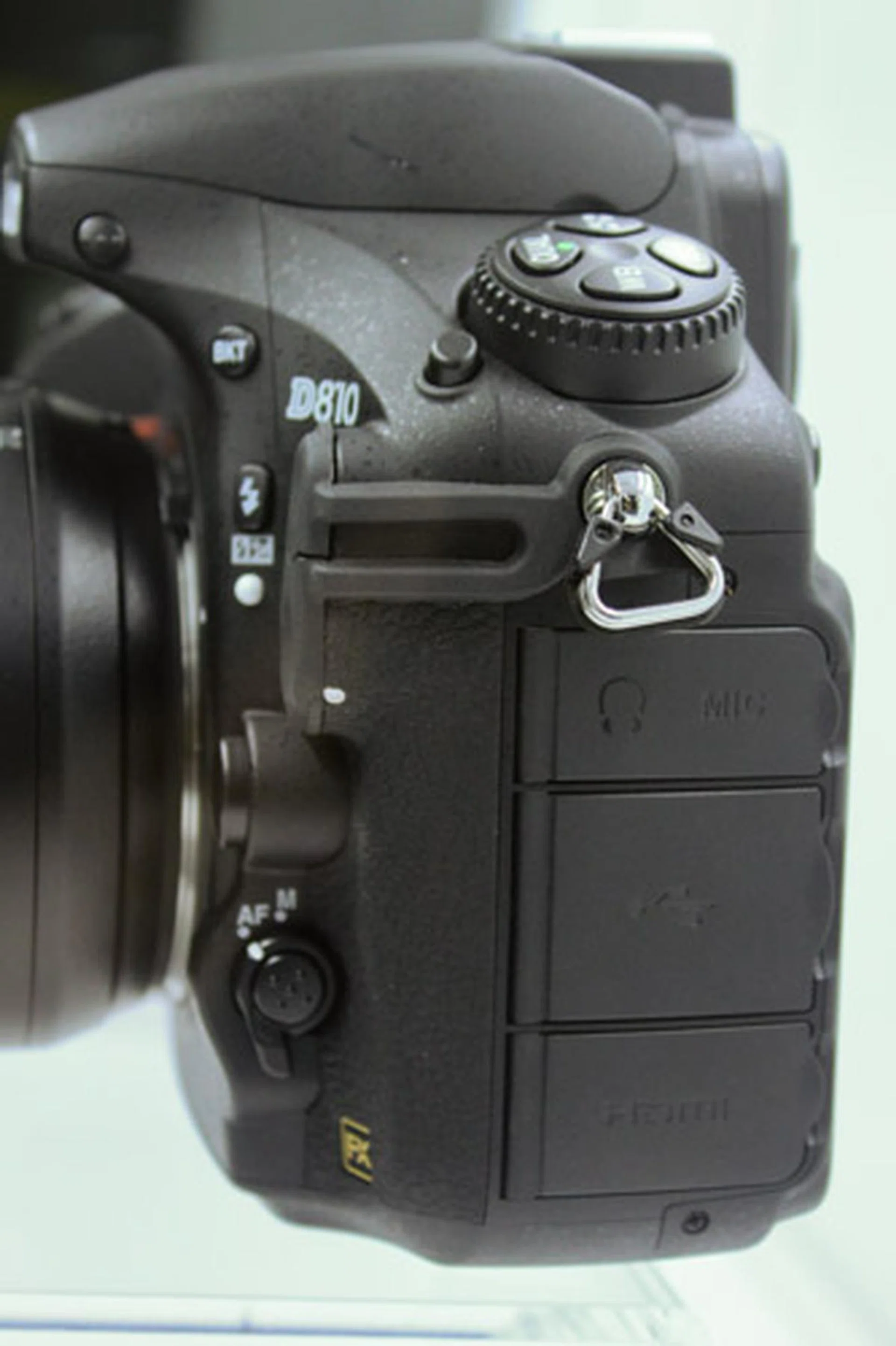 The left side of the camera is slightly different from the D800, with an additional flap for the mic input.