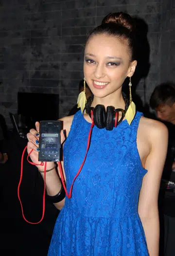 This pretty lady is holding up the new Sony Walkman NWZ-Z1050, an Android-based portable music player.