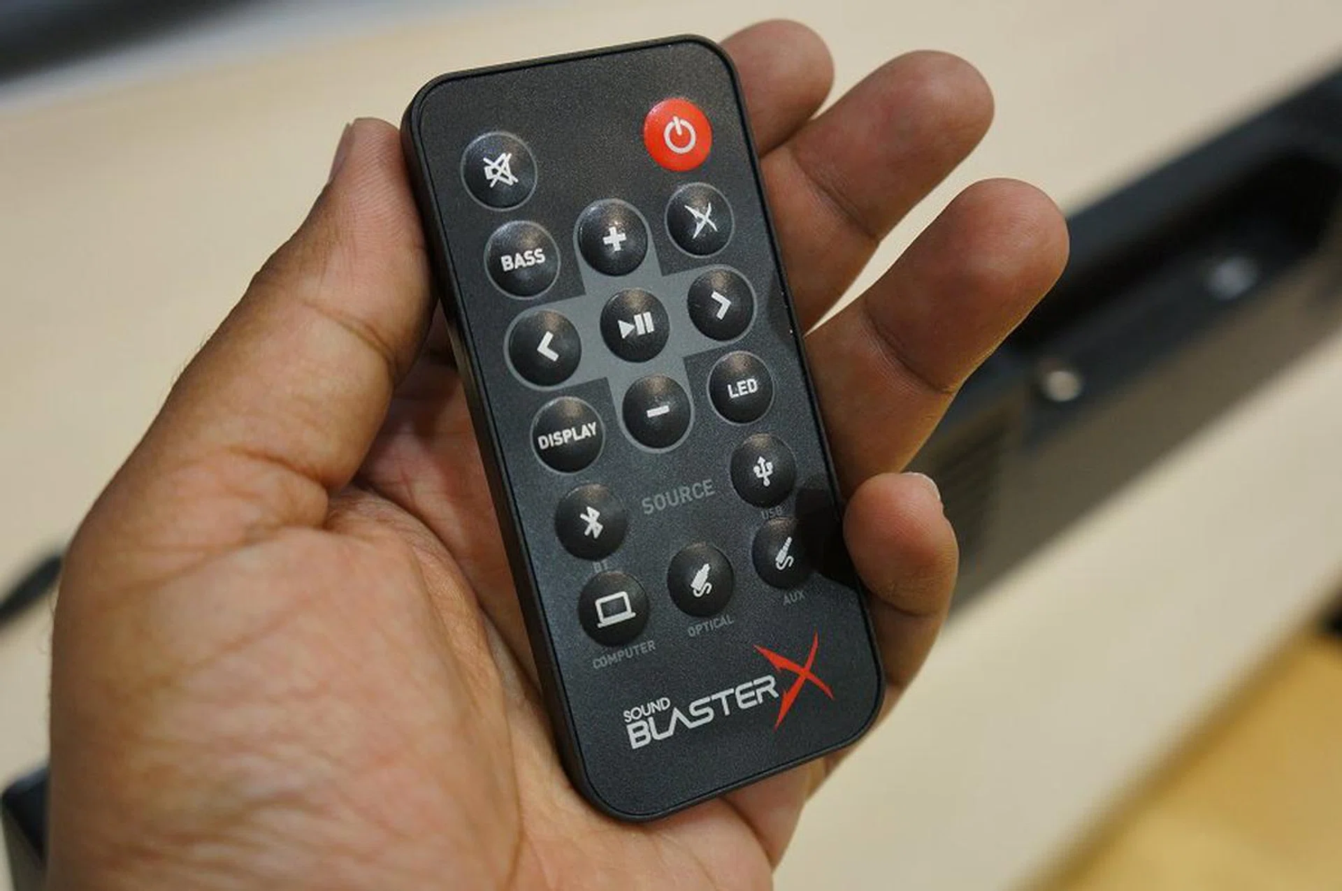 The simple remote provided with the Sound BlasterX Katana speaker system.