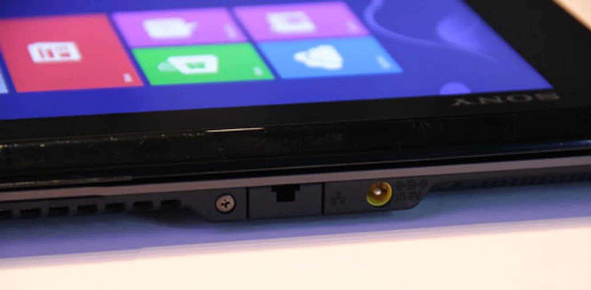 Around the back, you'll find the power port and a pull down RJ-45 port.