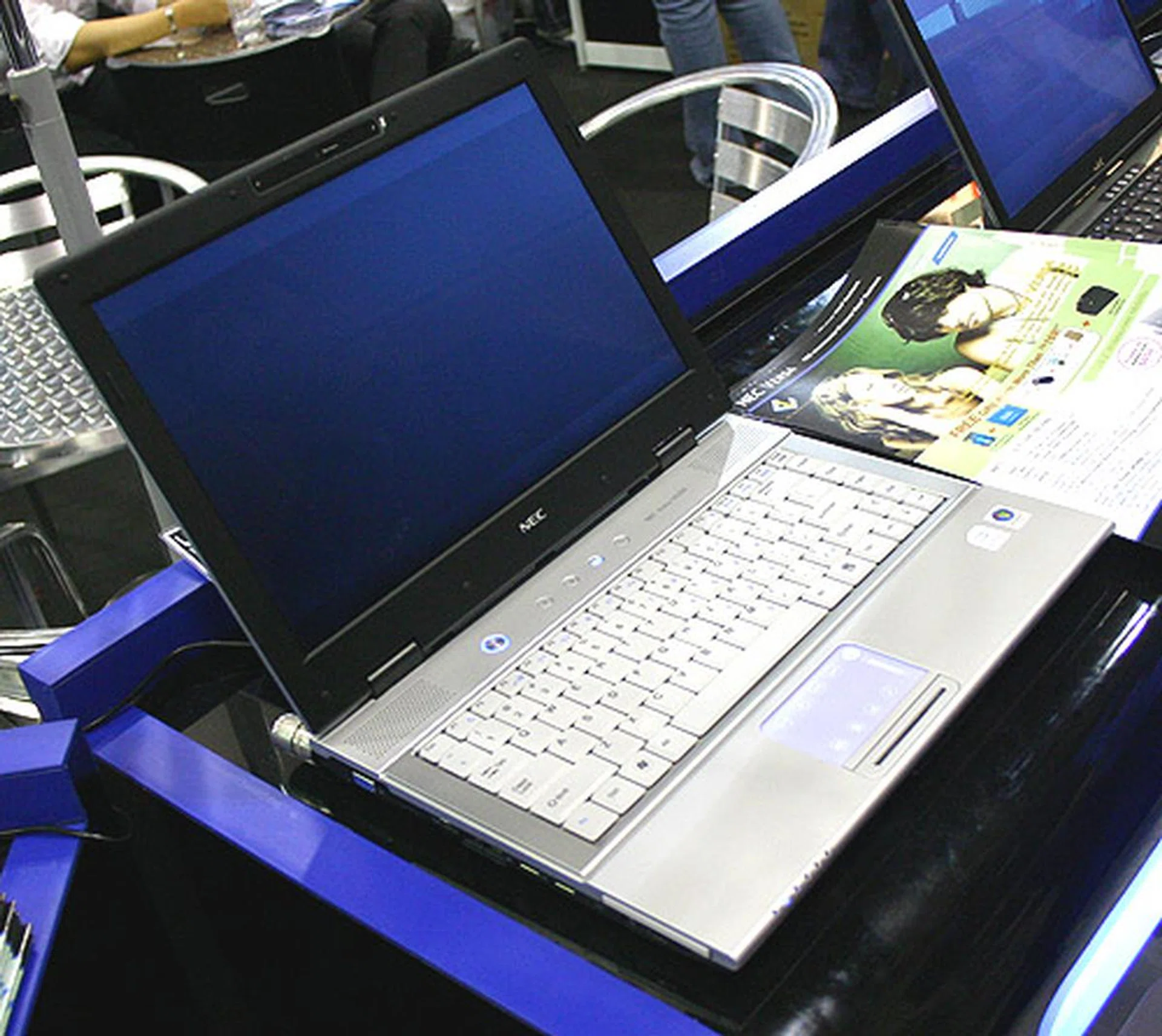  The new NEC Versa E6300 has some interesting design features that stand out from its competitors. A backlit touchpad lights up while the exterior has a leather texture and there's a 2.0 mega-pixel camera. Shortcut keys for recovery, email and Internet are also found. NEC has priced it at $1599 at Comex for this 14.1-inch notebook.  