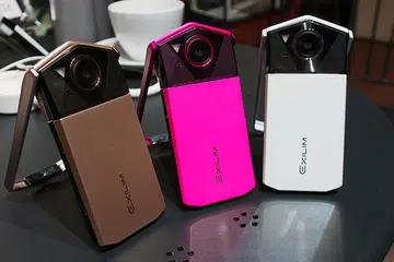 Casio EXILIM EX-TR70 in Gold, Pink, and White.