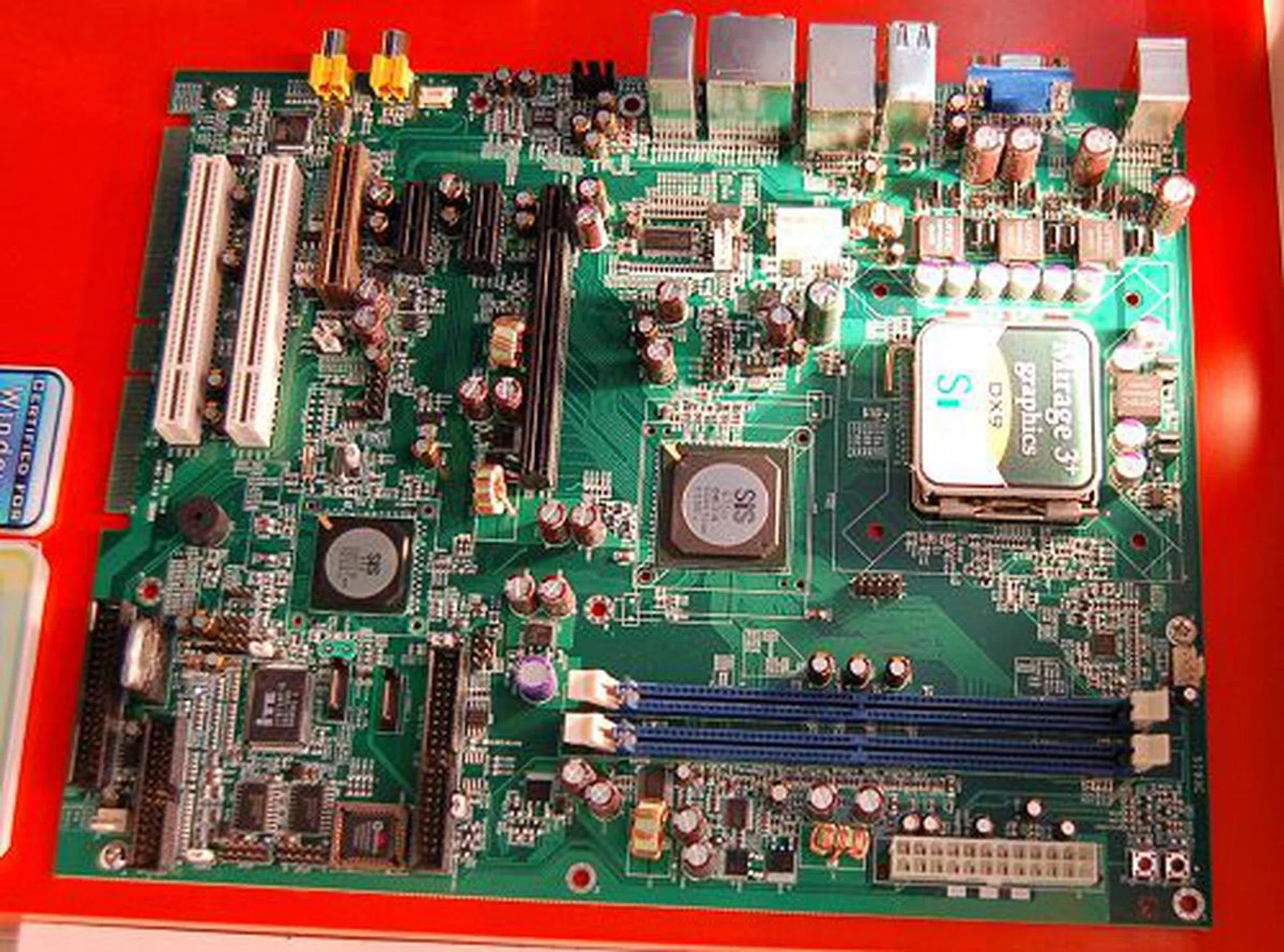  This is SiS 672FX chipset for the Intel platform. Although the SiS 671FX boards that we've featured in our CeBIT 2007 coverage are rather new and have just recently been rolling out, these are only Windows Vista Basic certified due to its Mirage 3 graphics engine. The SiS 672FX that's ready to roll out soon uses a faster Mirage 3+ graphics engine and has a couple more advances to its multimedia handling, thus giving the SiS 672FX chipsets the Vista Premium certified labeling. Like the 671 series, there are the FX and non-FX versions as well in the 672 series. The difference is in the FSB speed supported. FX handles up to 1066MHz while the non-FX makes do with 800MHz (i.e. low-end Intel processor offerings only).  