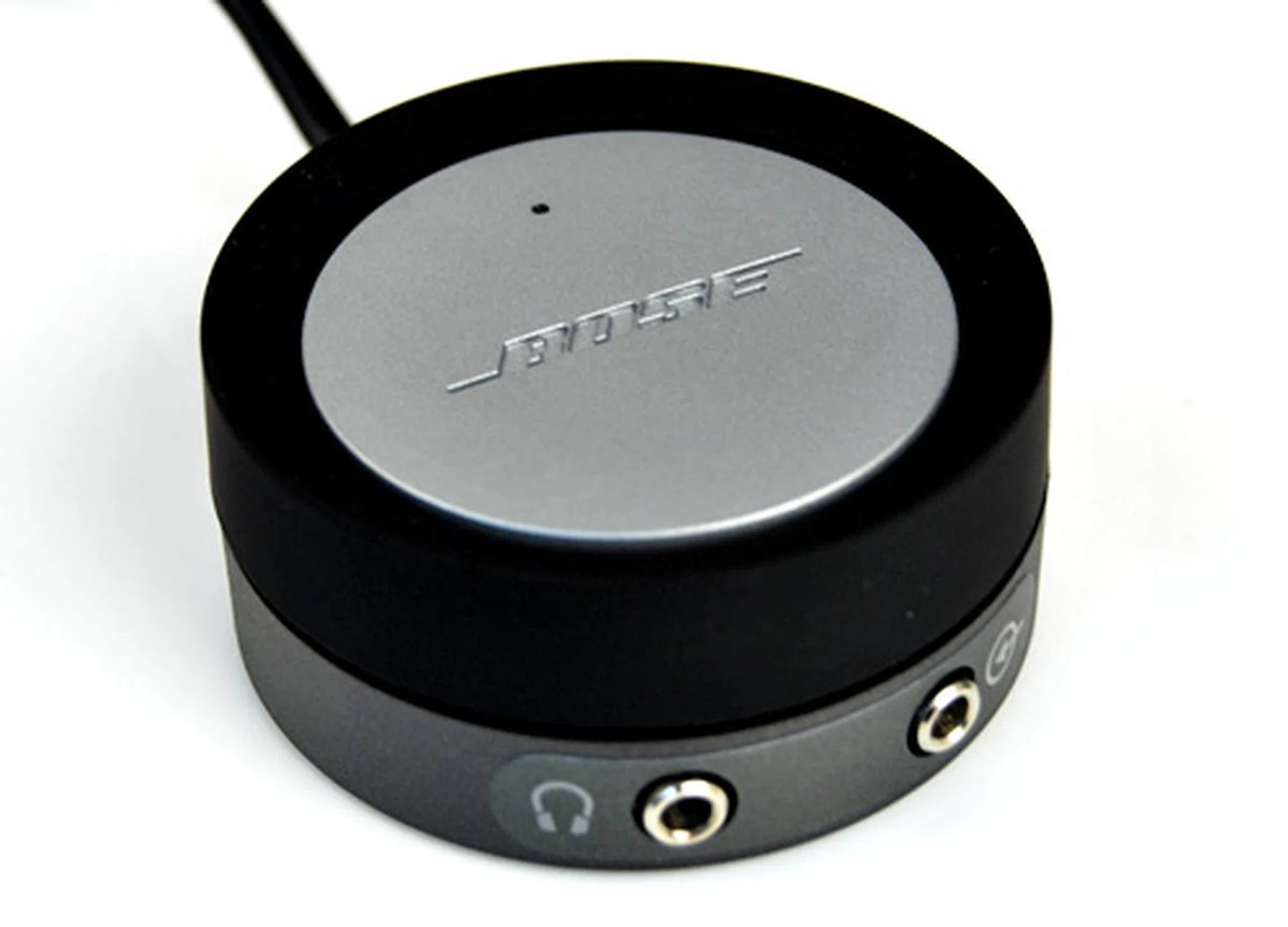 The wired remote control hub on the Bose allows you to adjust the system's volume and a light tap on the grey top allows you to instantly mute the speakers. And as you would expect, there are headphones and auxiliary 3.5mm jacks. No bass nor treble adjustment, sadly.