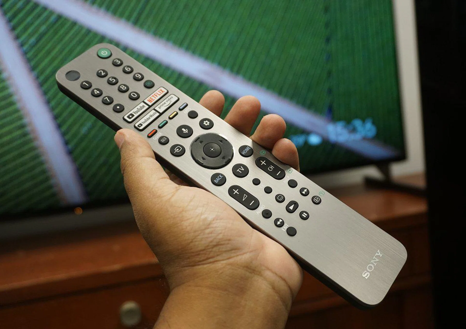 See what I mean? The remote is quite long and is not as easily balanced, nor sits as snugly in your hand as the LG Magic Wand remote.