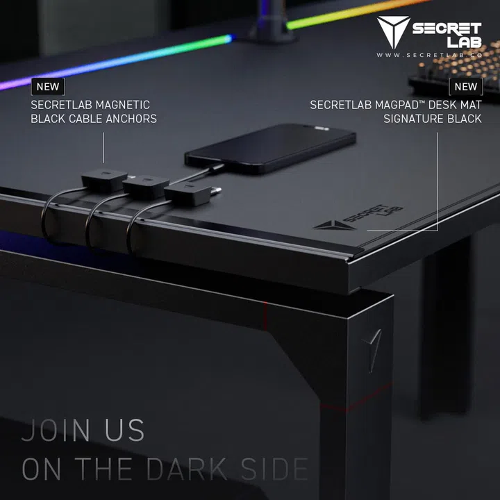 The Signature Black MAGPAD Desk Mat and cable anchors. (Image source: Secretab)