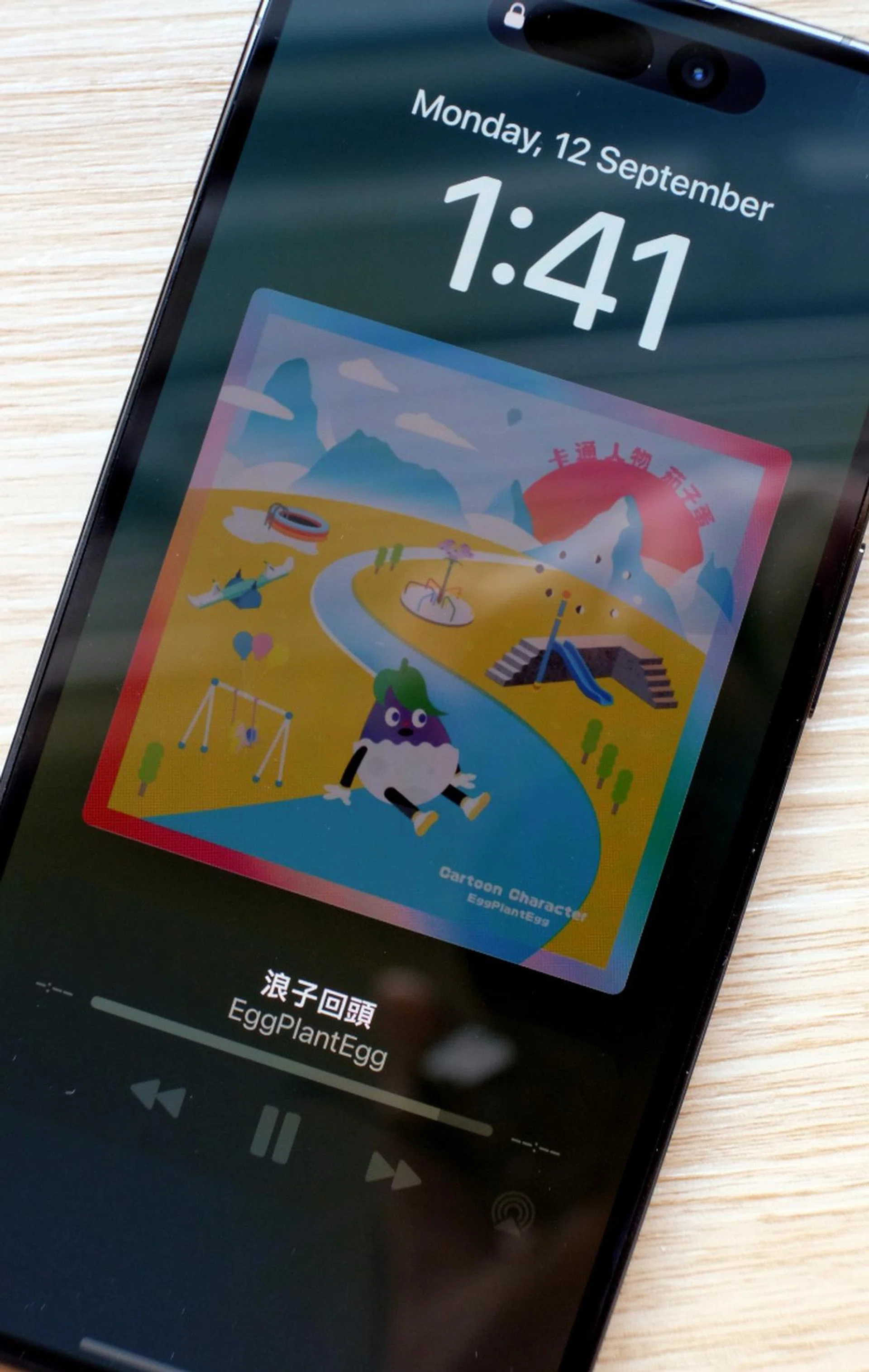 The always-on display in action. Note how important details like the date, time, and song title are slightly brighter.