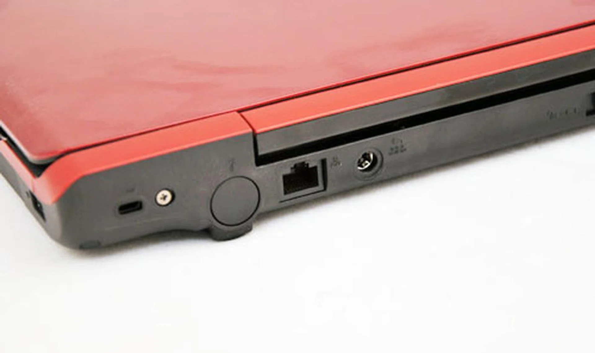 At the back you'll find the LAN and power jack. Next to the LAN port is an opening for a TV tuner that's not found on this SKU.