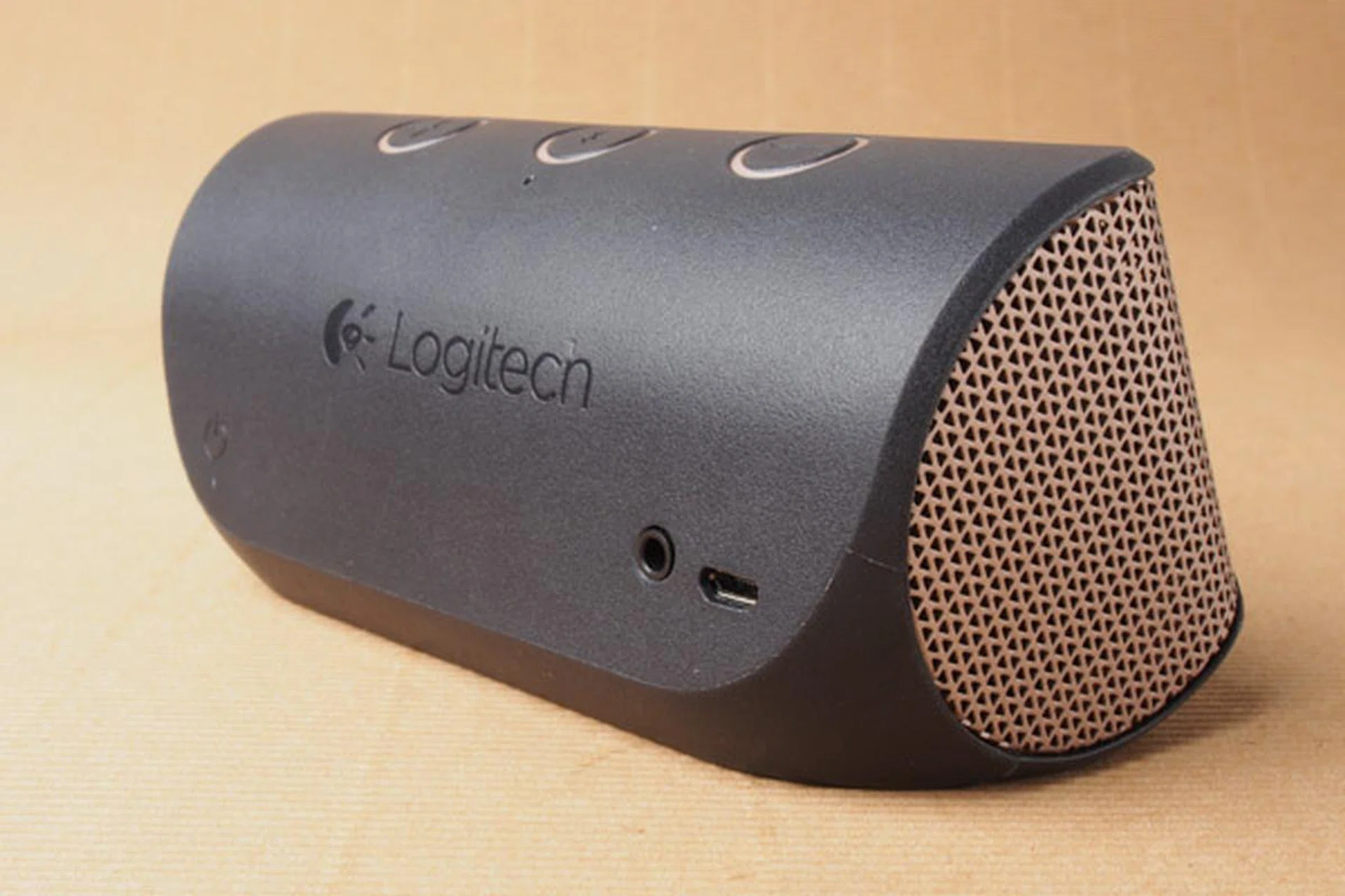 The power button, USB port, and Aux jack are all on the rear. 