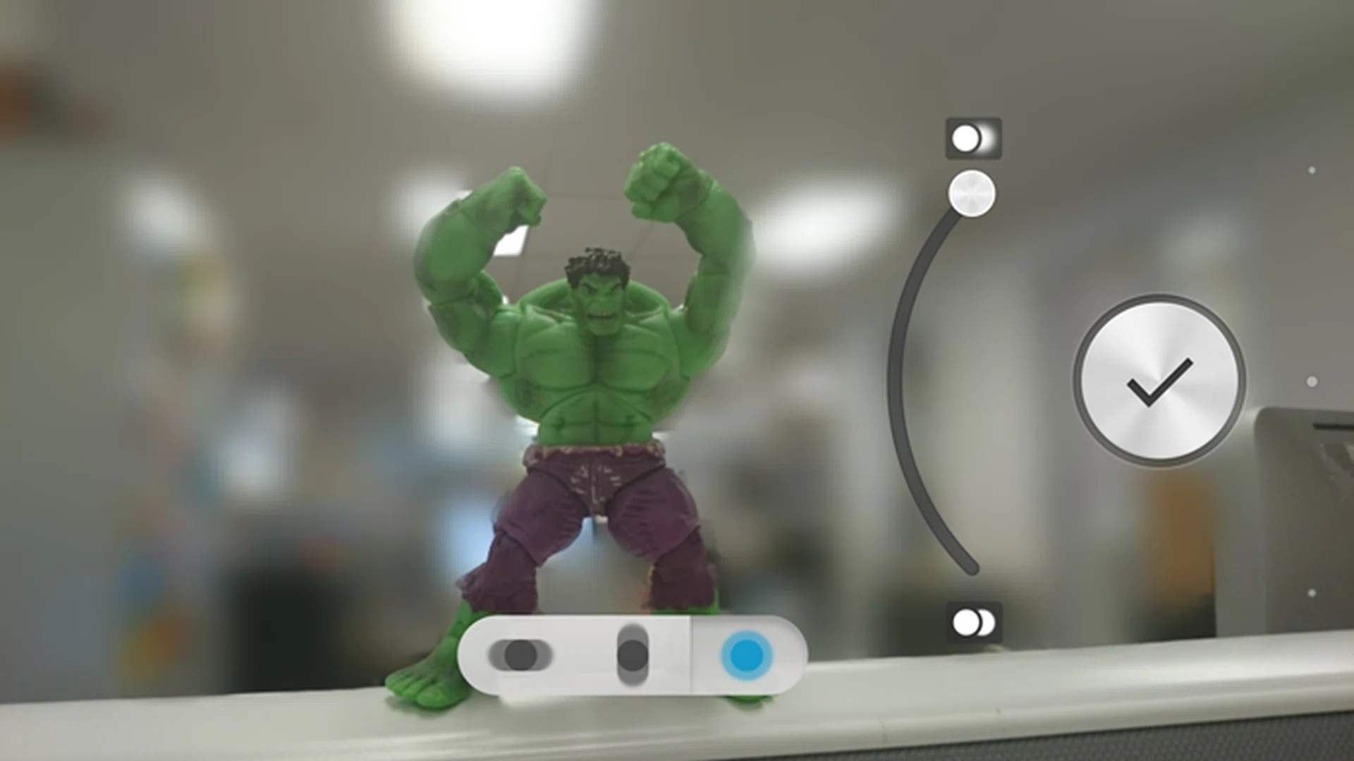 As you can see, the blur isn't perfect, and some areas like the Hulk's elbows have been blurred, despite being in the same focal plane as the rest of him. There's also quite an obvious outline around him where background details aren't blurred.