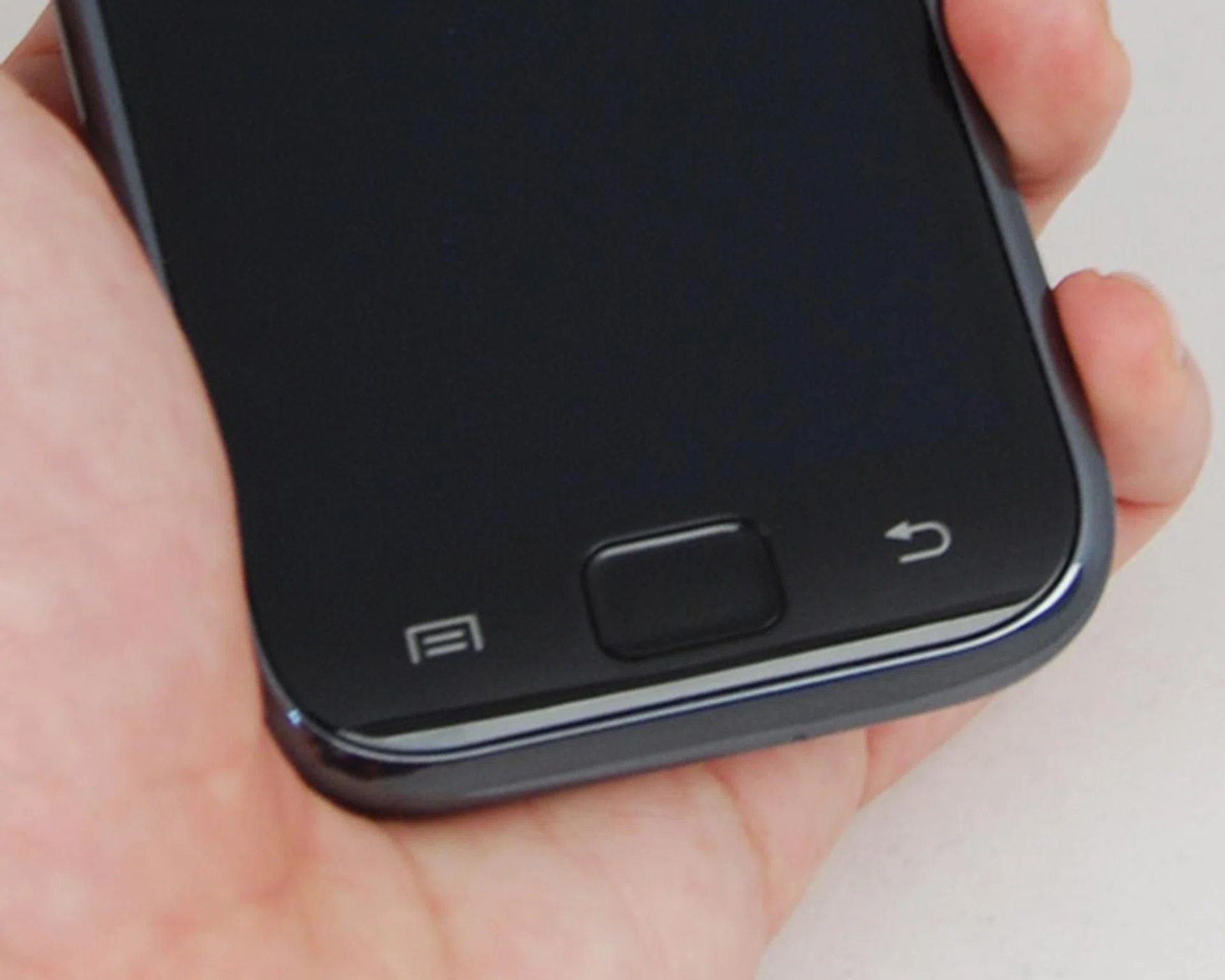 Two touch sensitive panels flanking the Home button at the bottom.