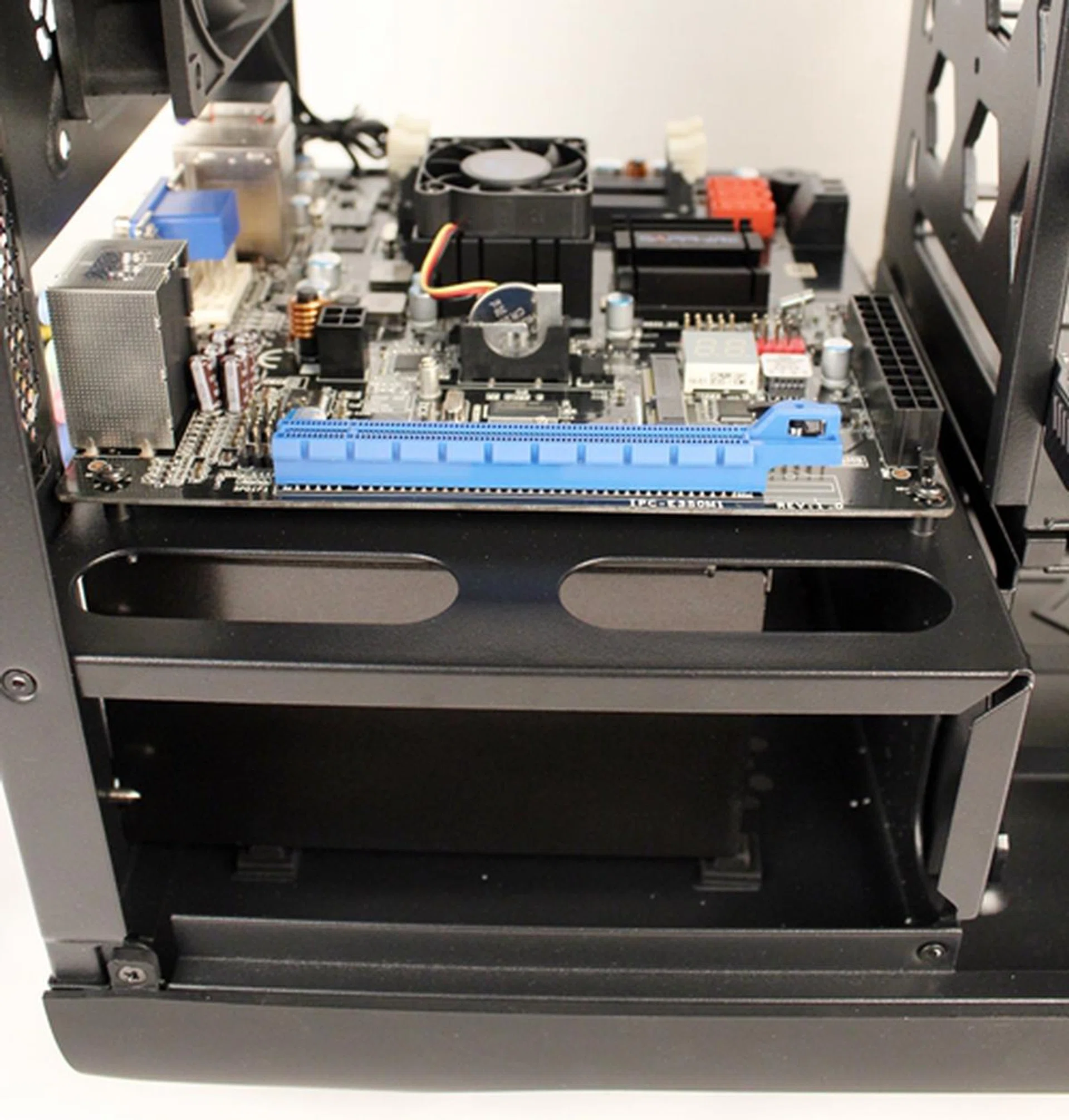 We placed and secured the motherboard on top of the PSU cage where the standoffs were already present.