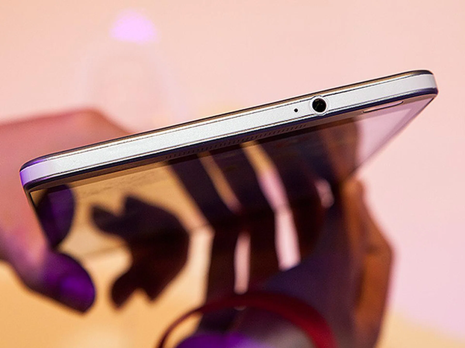 The earphone jack is located on the top side of the device.